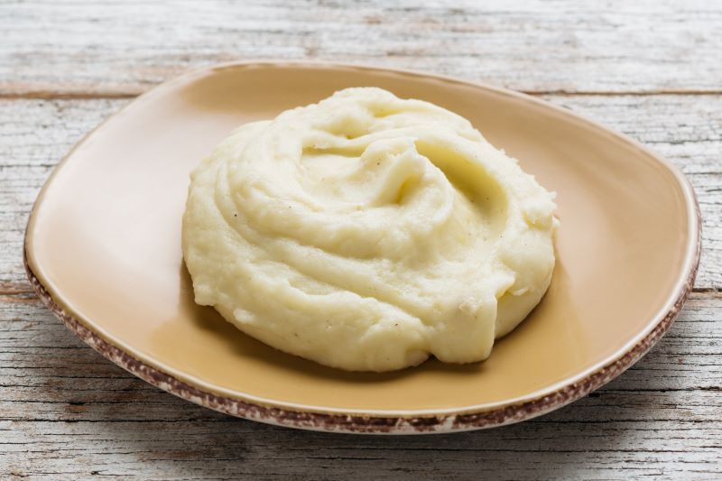 Order Mashed Potatoes (no Gravy) - Large food online from Urban Plates store, San Diego on bringmethat.com