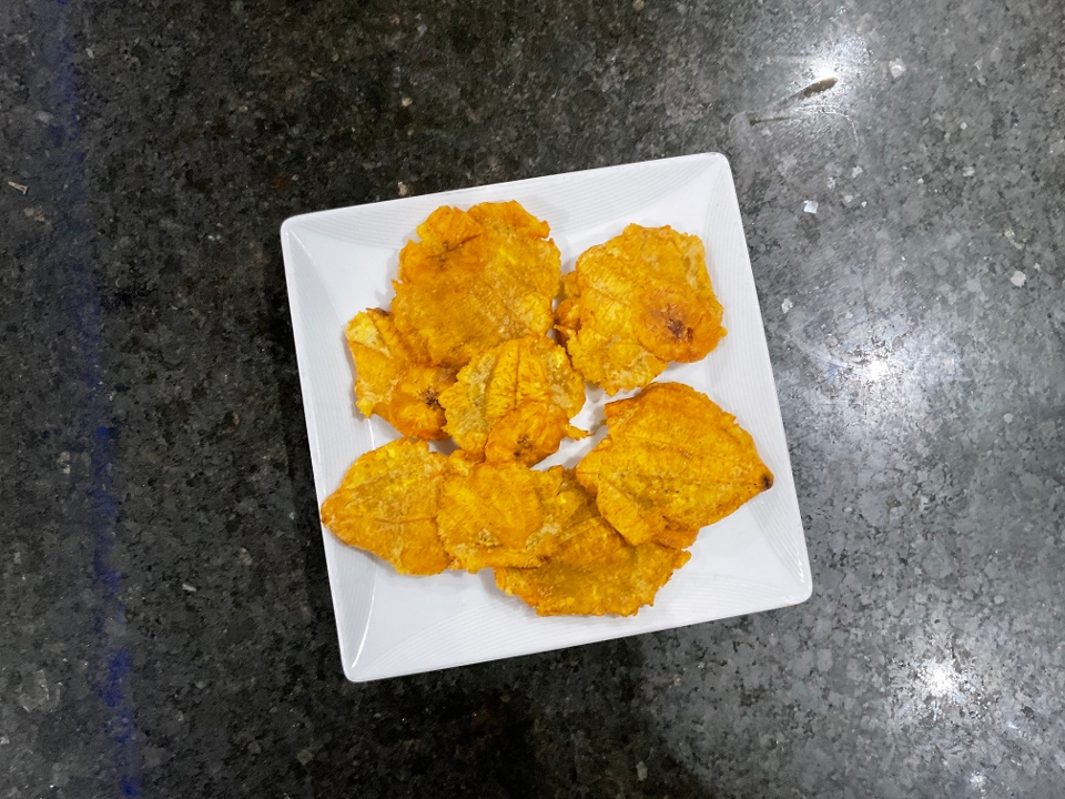 Order Tostones - Fried plantains food online from Don Quijote Restaurant store, Manchester on bringmethat.com