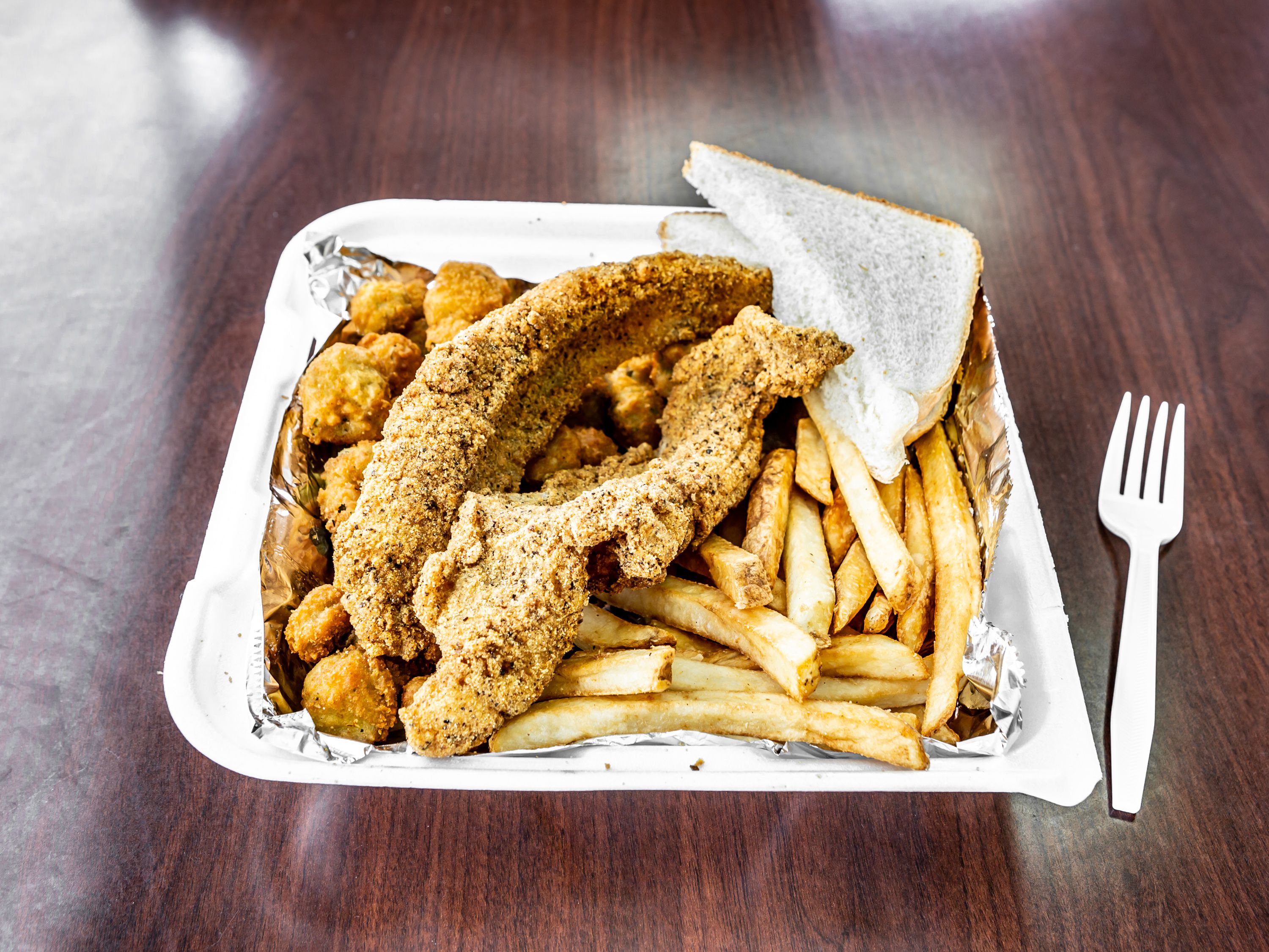 Order 2pc Fish Dinner food online from Wings Take Out store, Little Rock on bringmethat.com