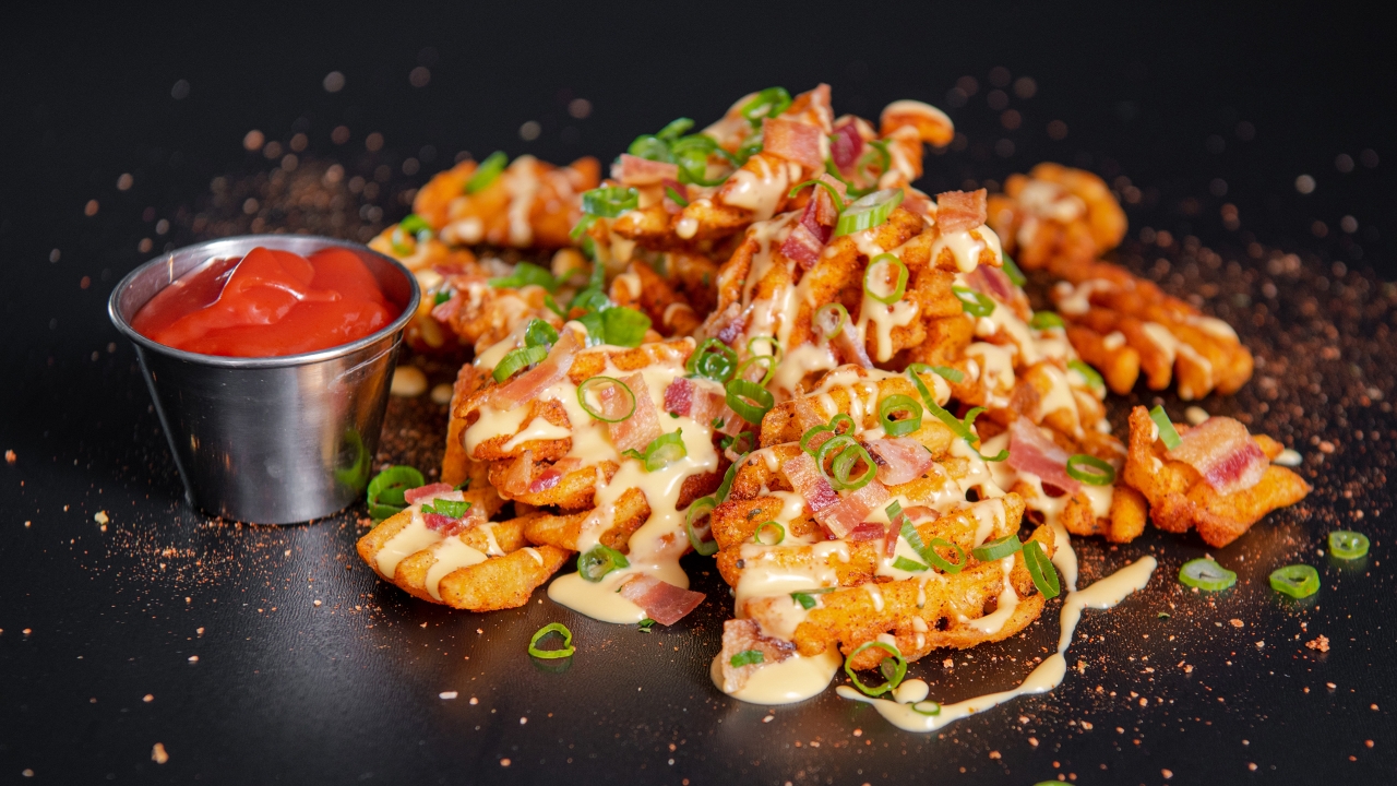 Order Loaded Waffle Fries food online from Sam Crispy Chicken store, Los Angeles on bringmethat.com