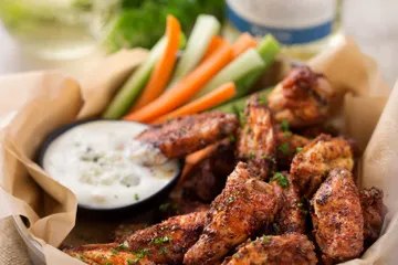Order Oven Roasted Chickne Wings food online from The Yeti Pub & Kaffeehaus store, Overland Park on bringmethat.com