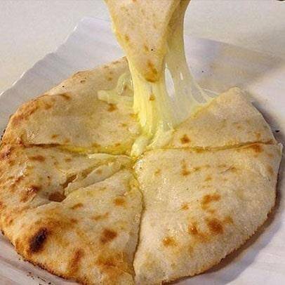 Order Cheese Naan food online from Sansar Indian Restaurant store, Tracy on bringmethat.com
