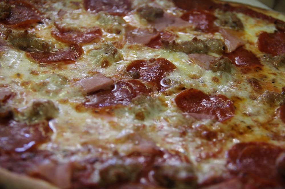 Order Meat Lovers Pizza food online from Fat Tomato Pizza store, Hermosa Beach on bringmethat.com
