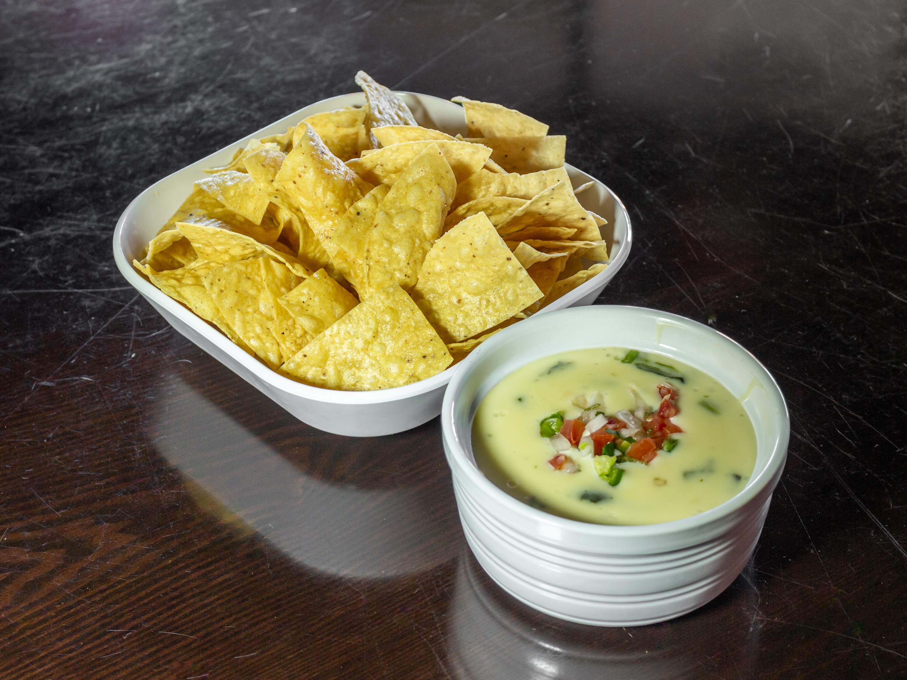 Order Chips and Queso food online from Mojitos Mexican Bar & Grill store, Odessa on bringmethat.com