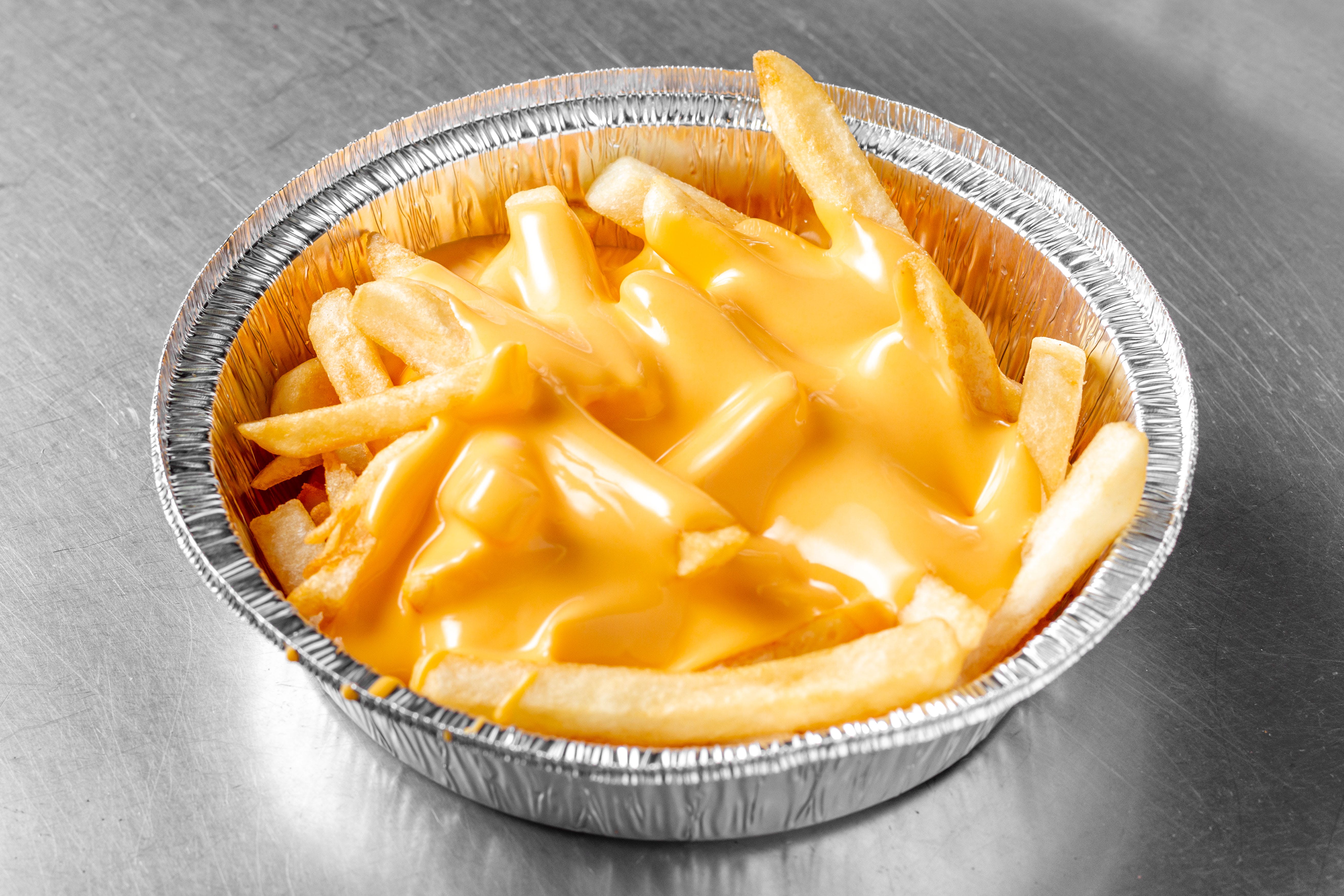 Order French Fries with Nacho Cheese - Regular food online from Pizza Planet store, Baltimore on bringmethat.com