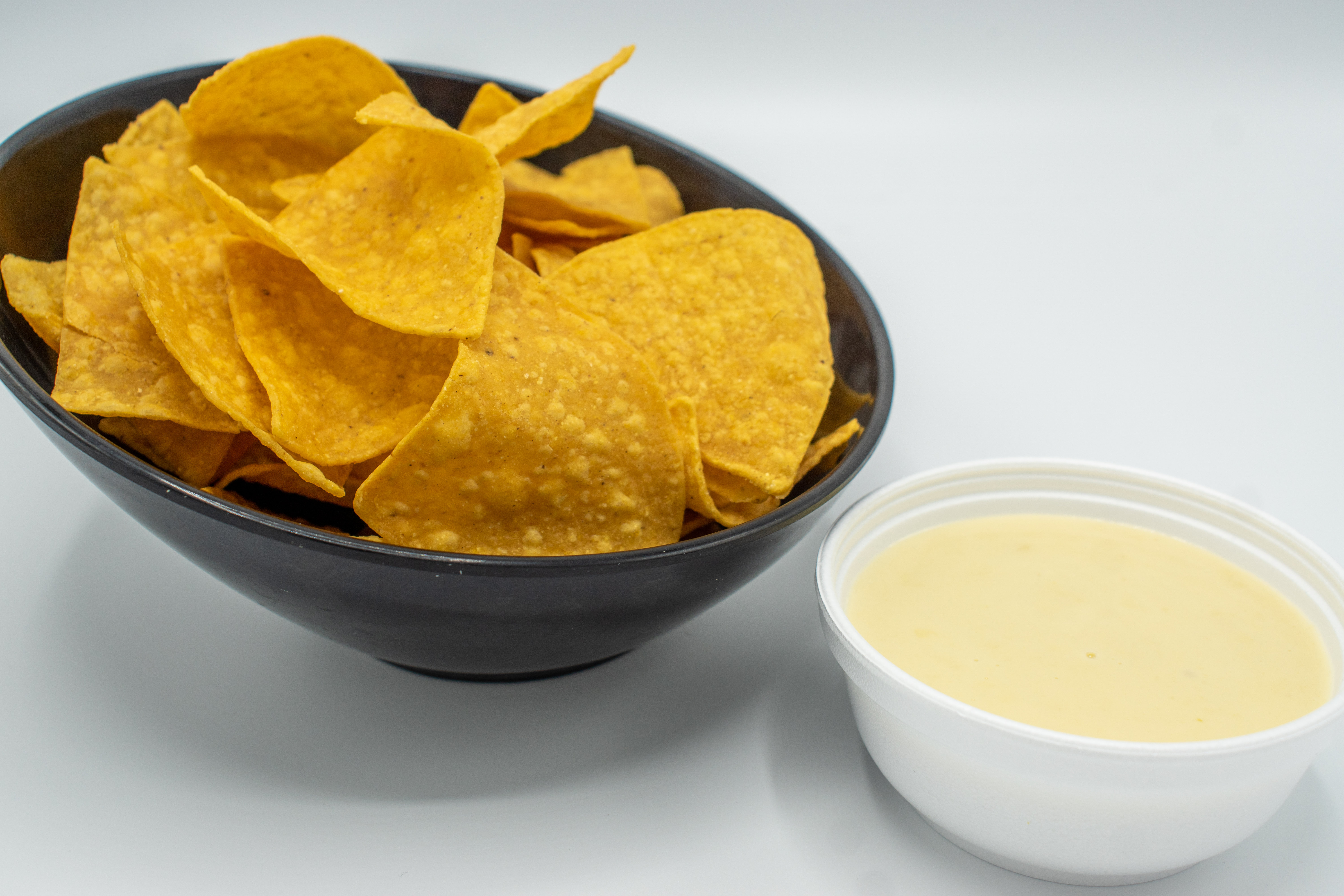 Order QUESO DIP food online from Tacos Guac N Bowl store, Reading on bringmethat.com