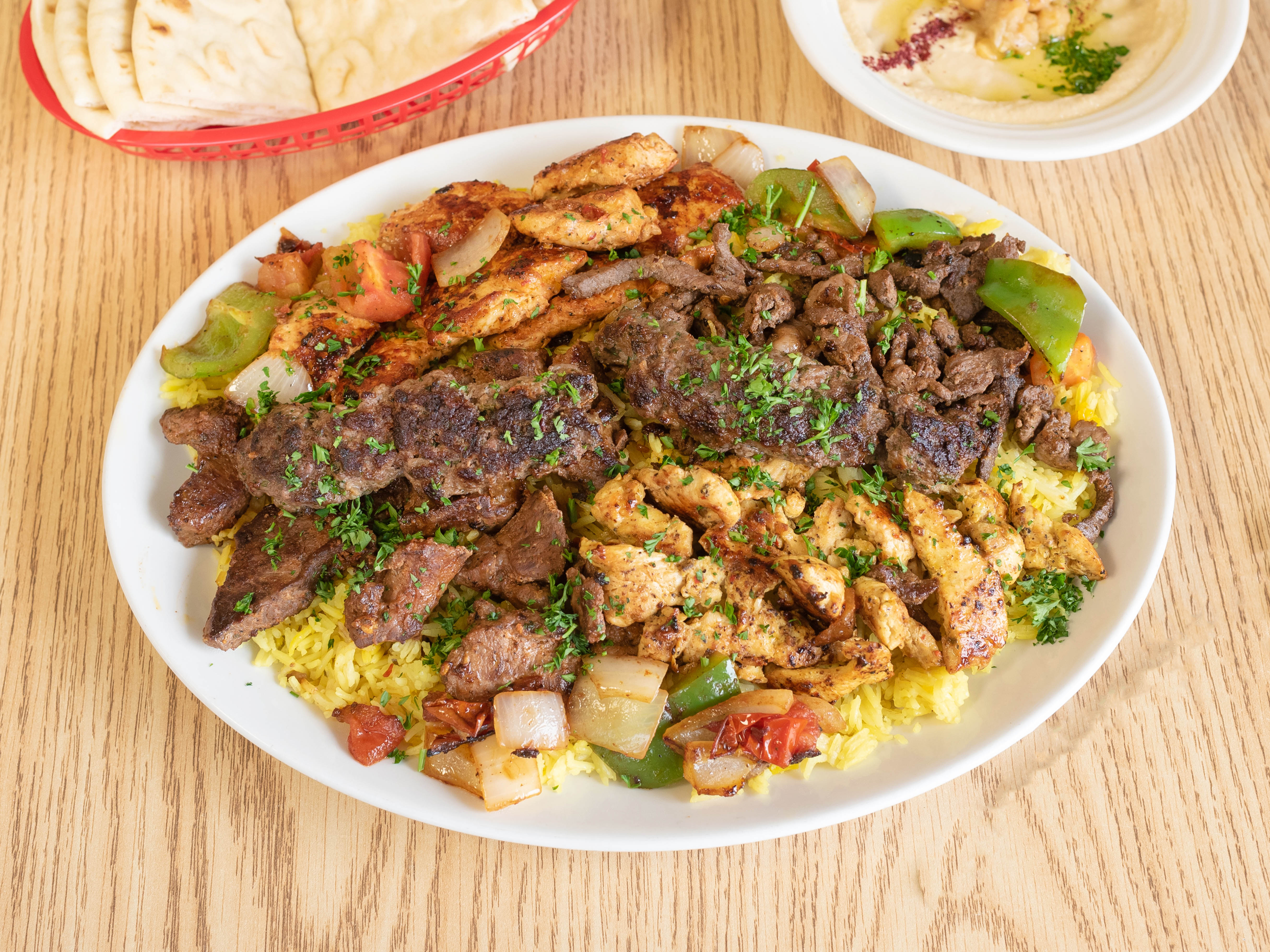 Order Family Mashawi Mix Plate with Hummus food online from Queen Sweets & Bakery store, Kansas City on bringmethat.com