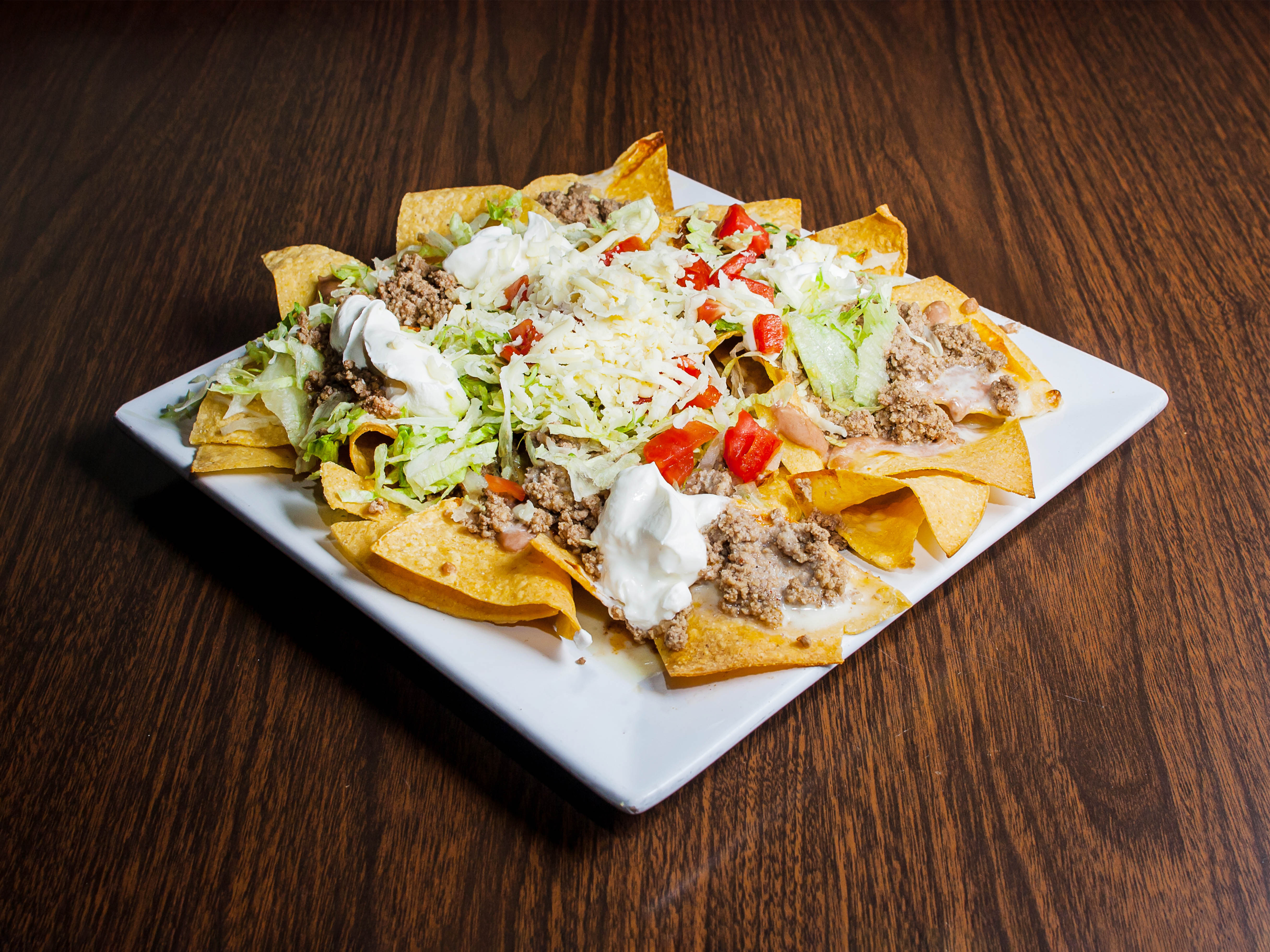 Order Nachos Supreme food online from The Blue Iguana Bar & Grill store, Columbus on bringmethat.com