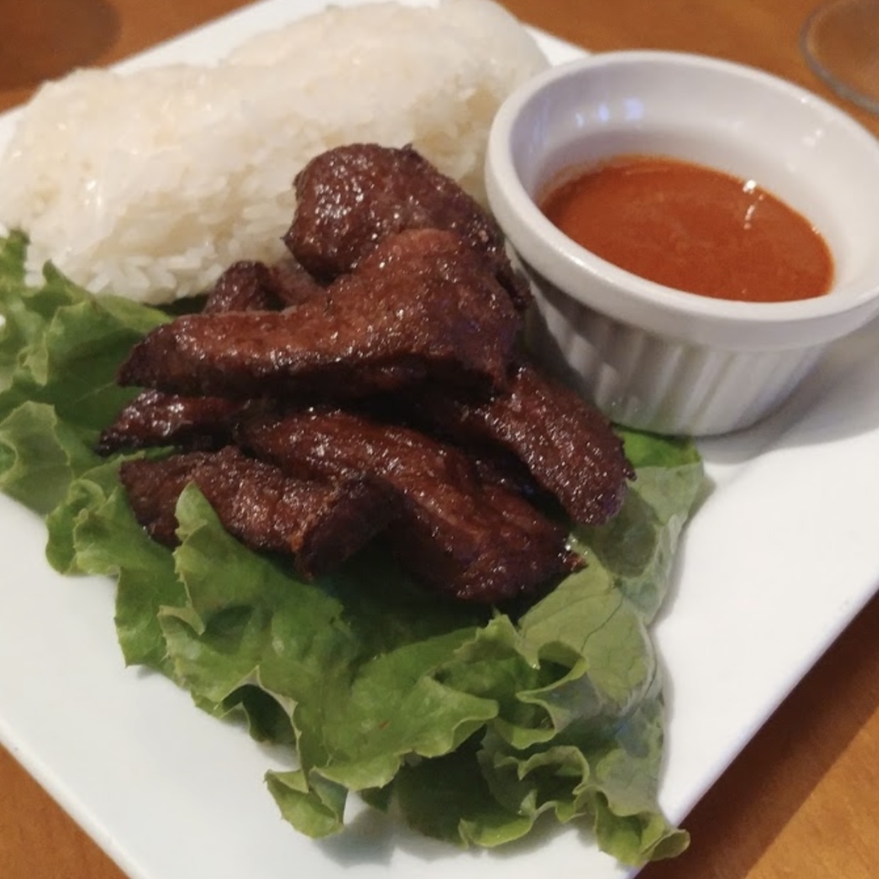 Order Thai Beef Jerky with Sticky Rice food online from Mango Thai Restaurant store, Saint Paul on bringmethat.com