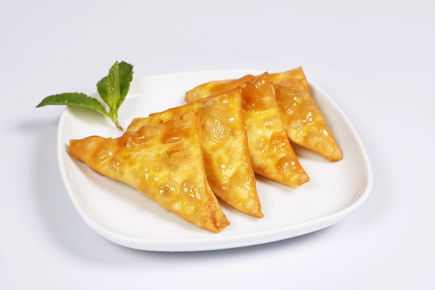 Order 4 Piece Crab and Cheese Rangoon  food online from Tom Dim Sum store, Media on bringmethat.com
