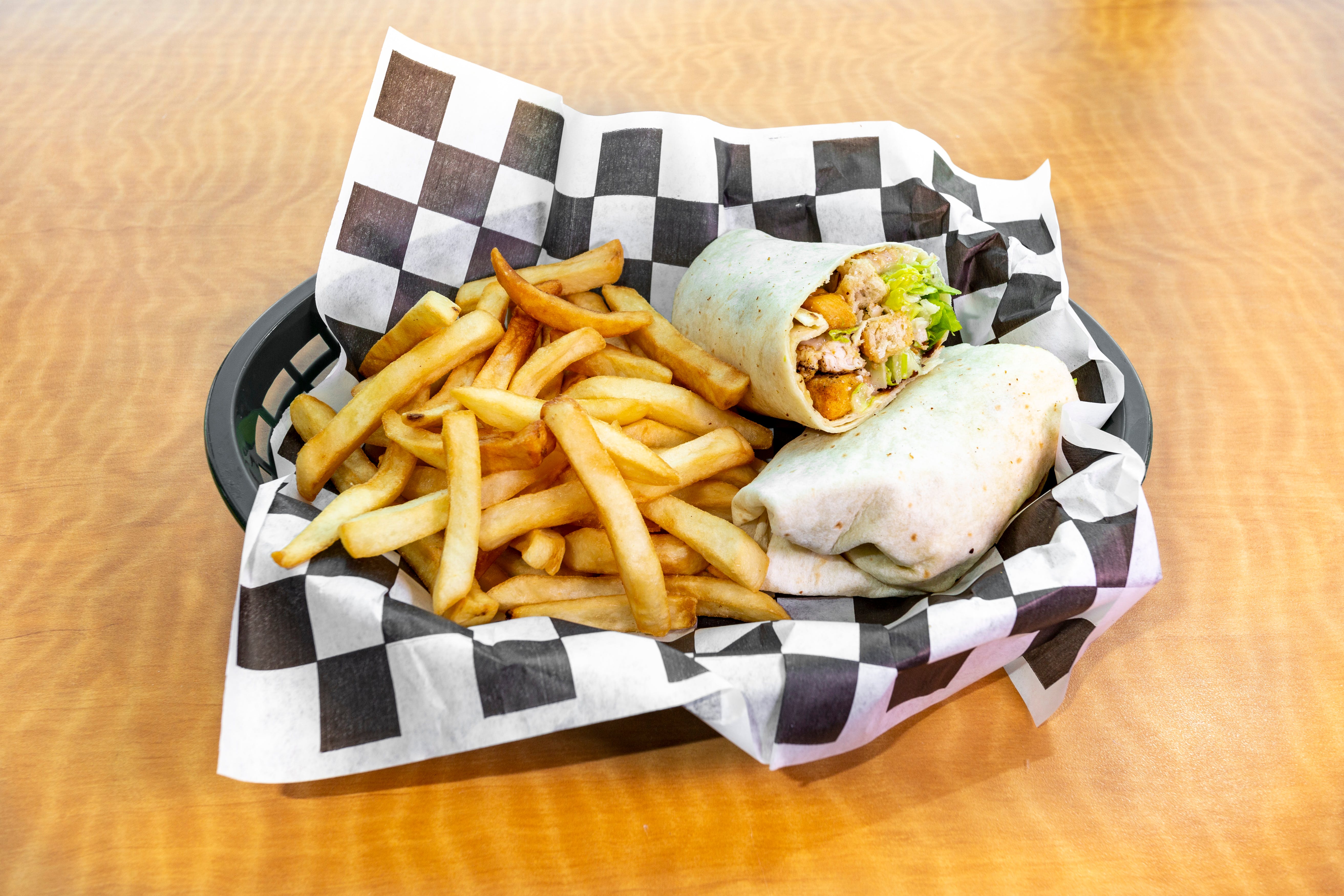 Order Grilled Chicken Caesar Wrap - Wrap food online from Mario Cafe & Pizzeria store, East Greenville on bringmethat.com