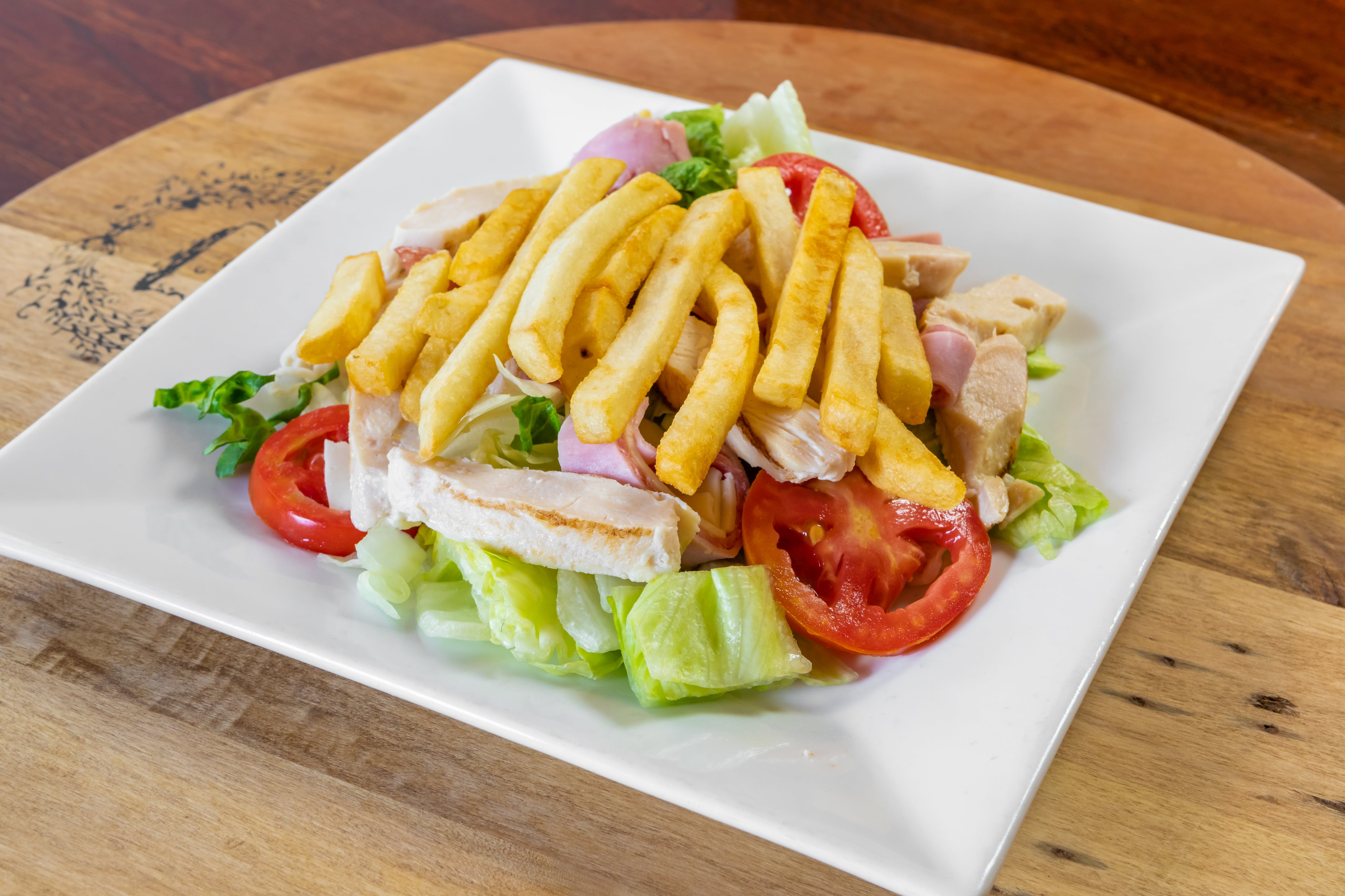 Order Grilled Chicken Salad - Salad food online from Capri Restaurant store, Natrona Heights on bringmethat.com