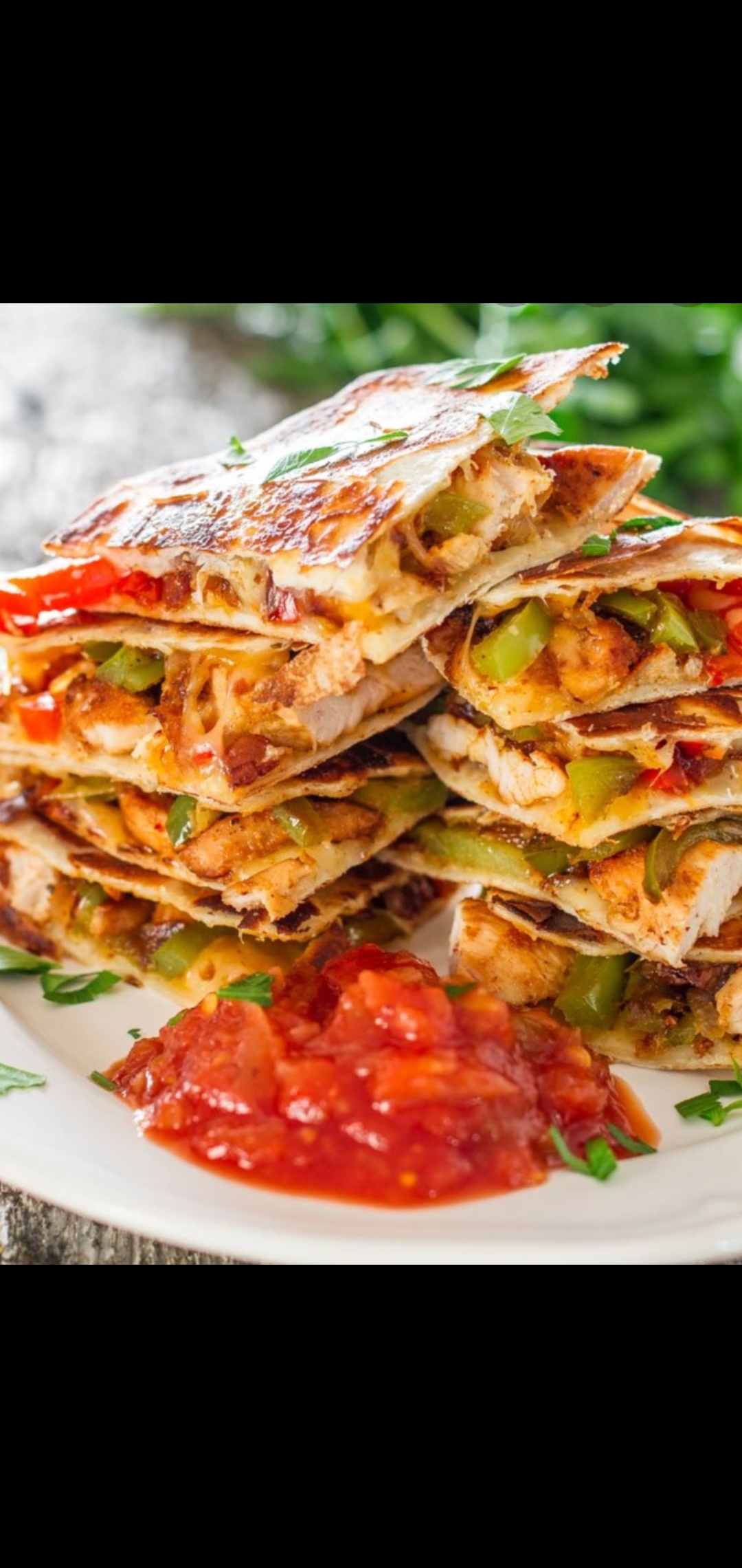 Order Spicy Chicken Cutlet Quesadilla (spicy Chicken peppers onions cheddar & pepper  jack cheese salsa & side sour cream) food online from American Gourmet Foods Deli store, New York on bringmethat.com