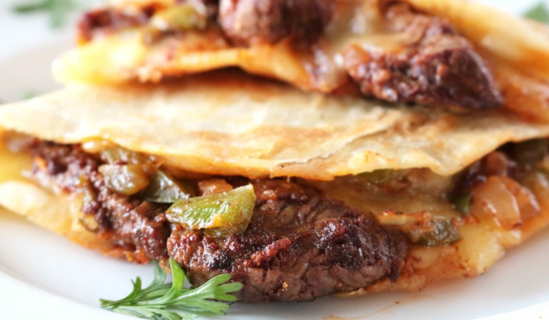 Order Grilled Steak Quesadilla food online from Janik's Cafe store, Chicago on bringmethat.com