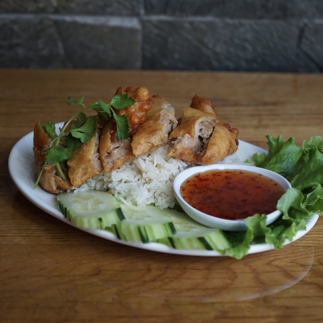 Order Garlic Rice with Crispy Chicken food online from Lers Ros Thai  store, San Francisco on bringmethat.com