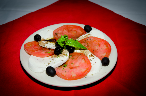 Order Mozzarella and Tomatoes Salad food online from Prima Pasta & Cafe store, Howard Beach on bringmethat.com