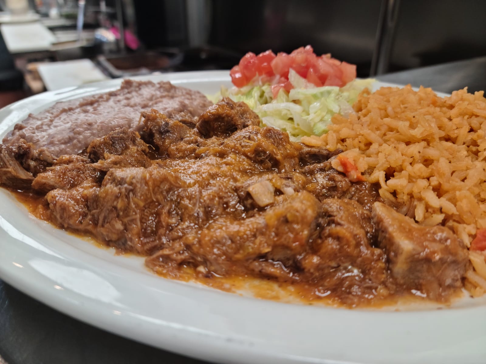 Order Carne Guisada Plate food online from Los Arcos Mexican Grill store, San Antonio on bringmethat.com