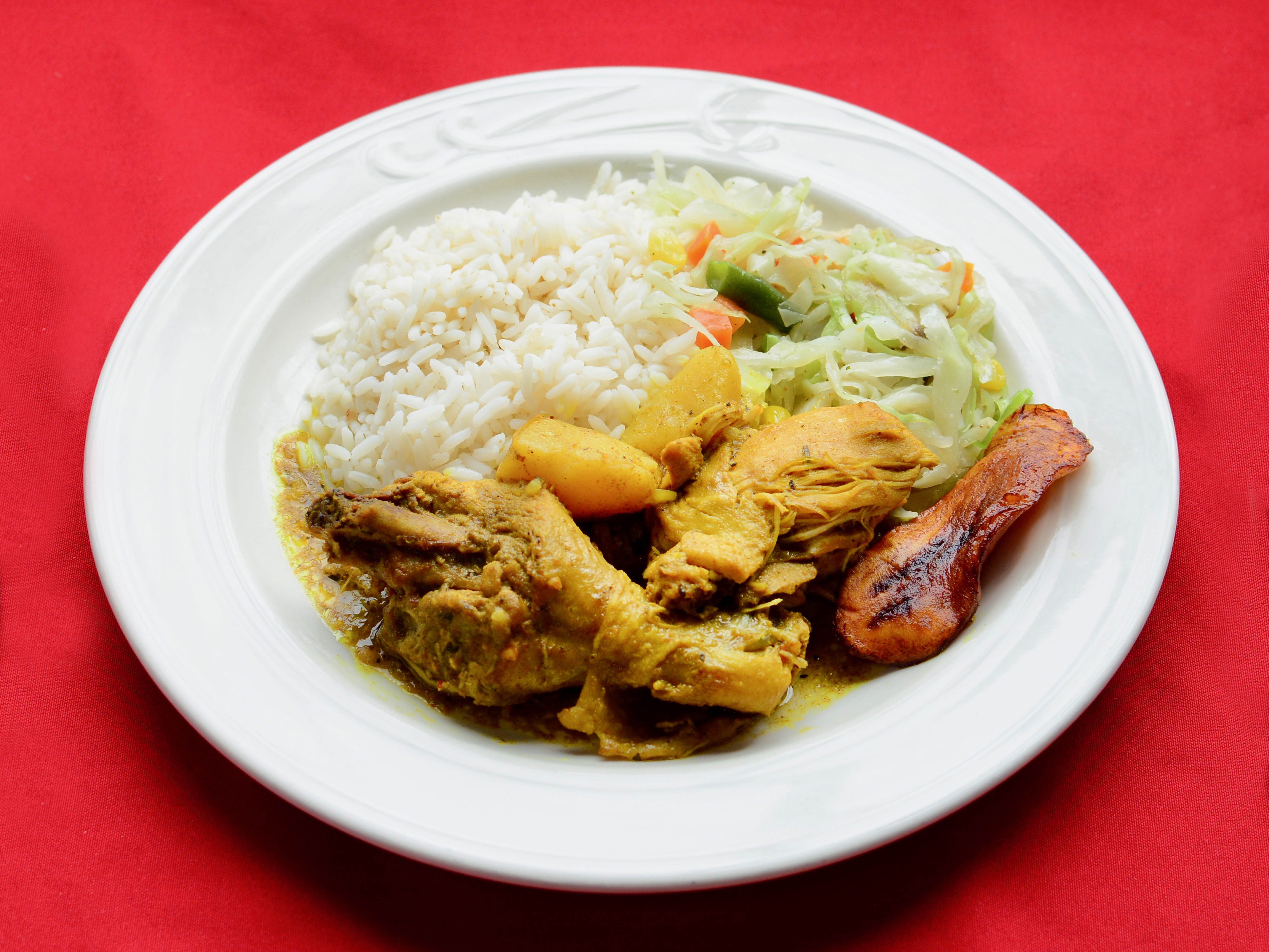 Order Curry Chicken with Plain Rice food online from Taste of the Caribbean store, Capitol Heights on bringmethat.com