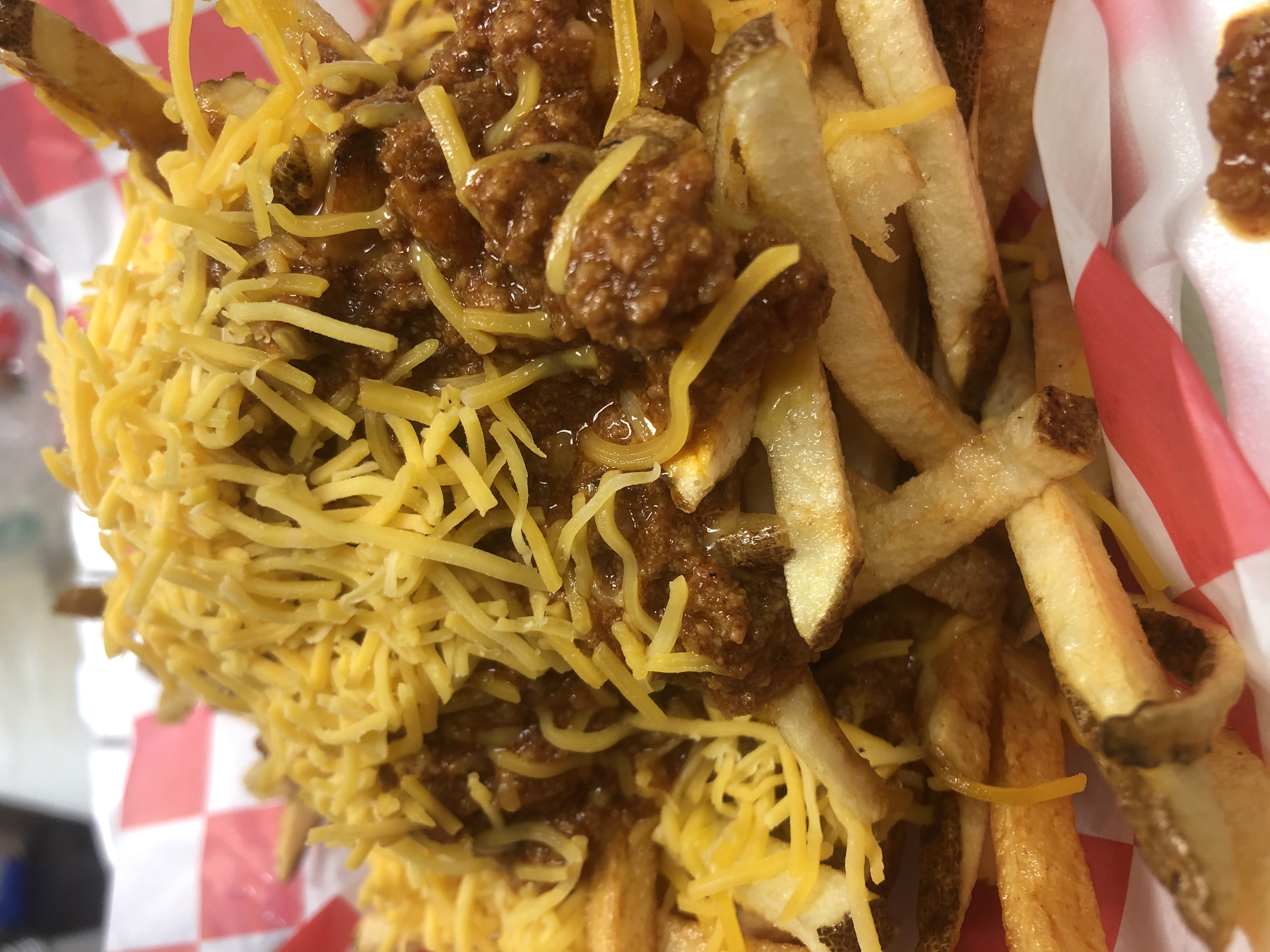 Order Chili Cheese Fries 1/2 Basket food online from Dog Daze Gourmet Hot Dogs store, Canton on bringmethat.com