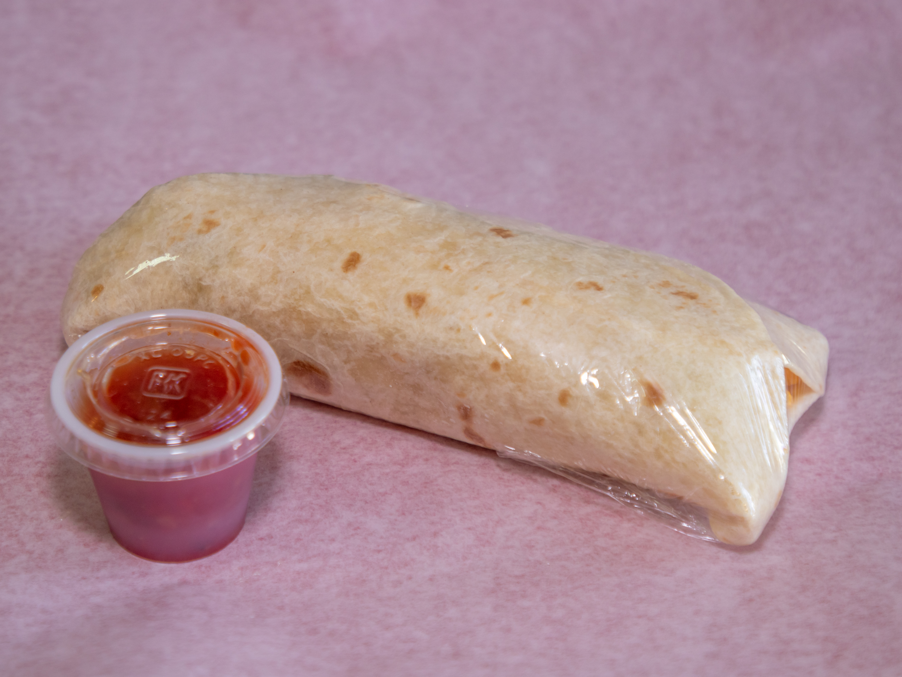 Order Sausage, Egg & Cheese Burrito food online from Donuts Coffee store, Las Vegas on bringmethat.com