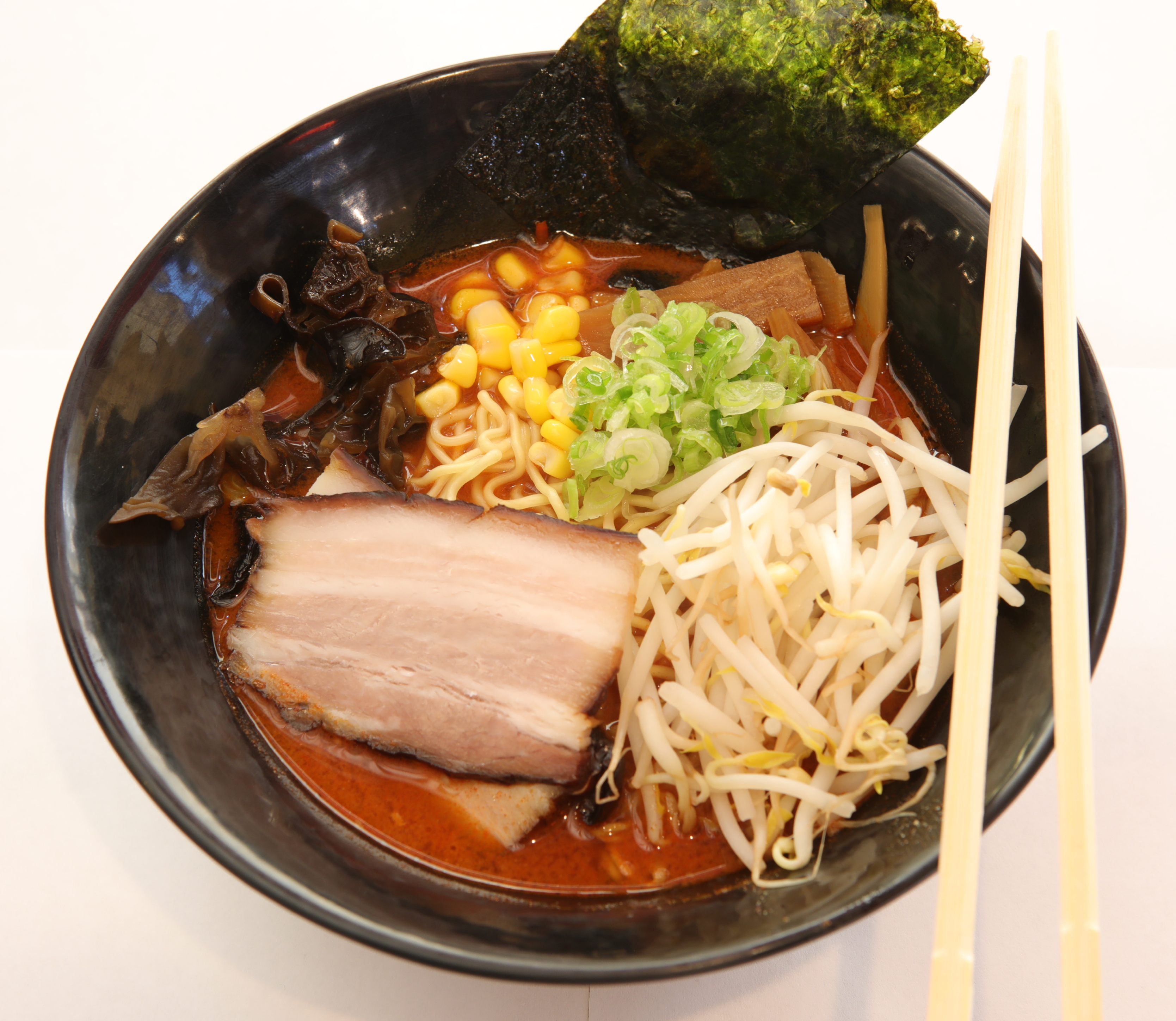 Order Spicy Miso Tonkotsu Ramen Deluxe food online from PRIME SHABU AND RAMEN store, Lake Forest on bringmethat.com