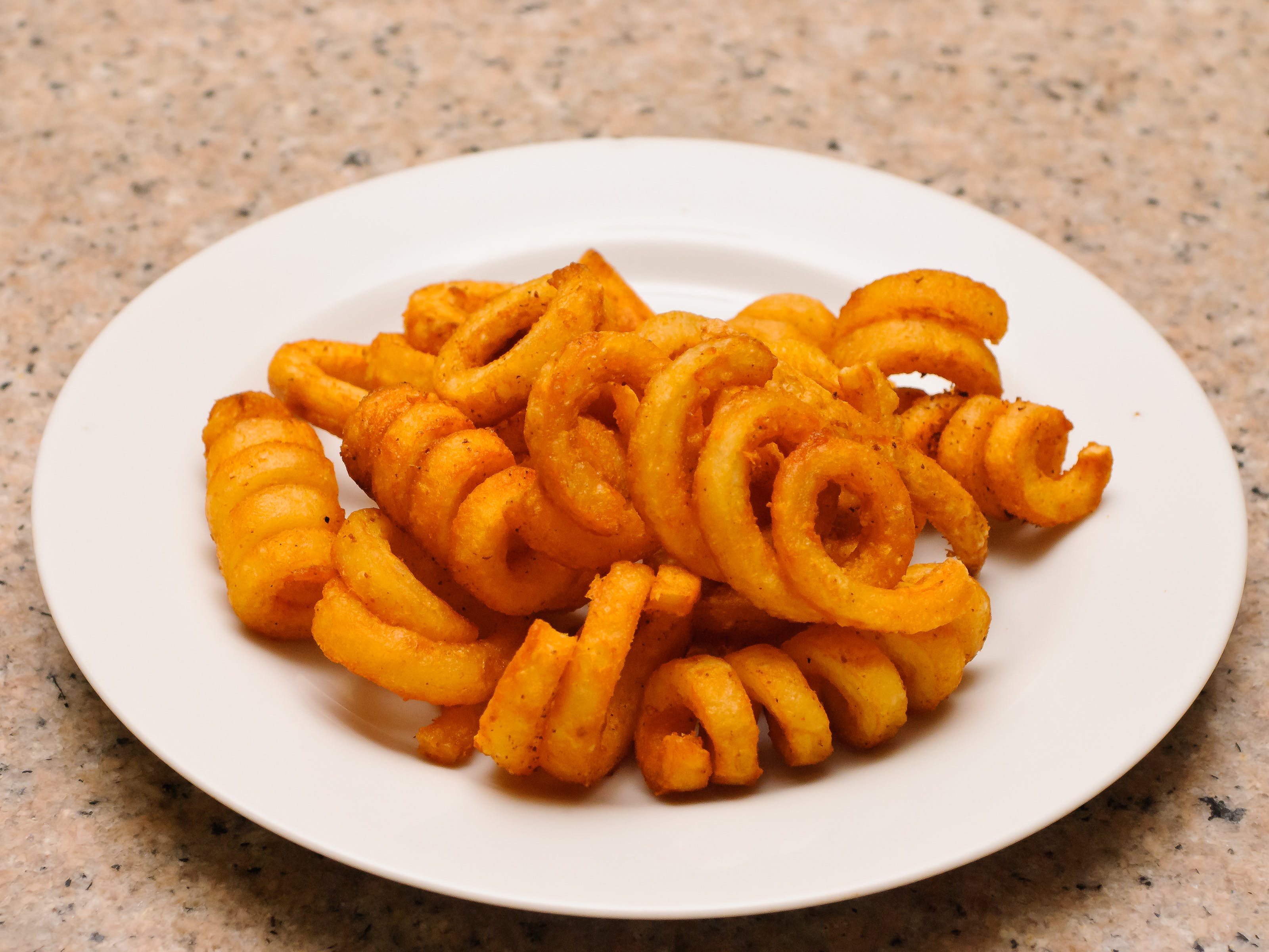 Order Curly Pizza Fries - Appetizer food online from Amigos Restaurant & Pizza store, Cheltenham on bringmethat.com