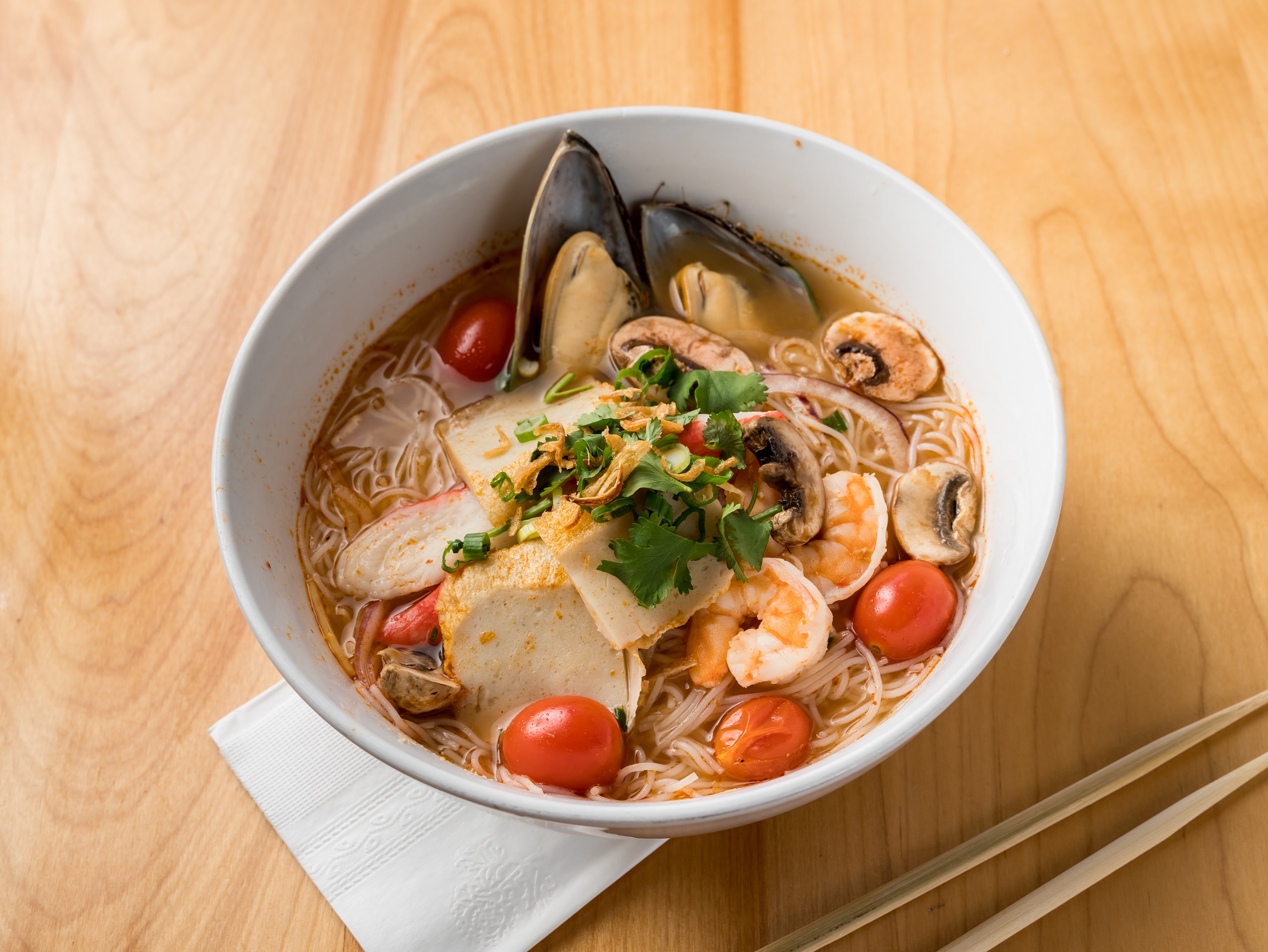 Order Tom Yam Seafood Noodle food online from Eat Noodle store, Bridgeport on bringmethat.com