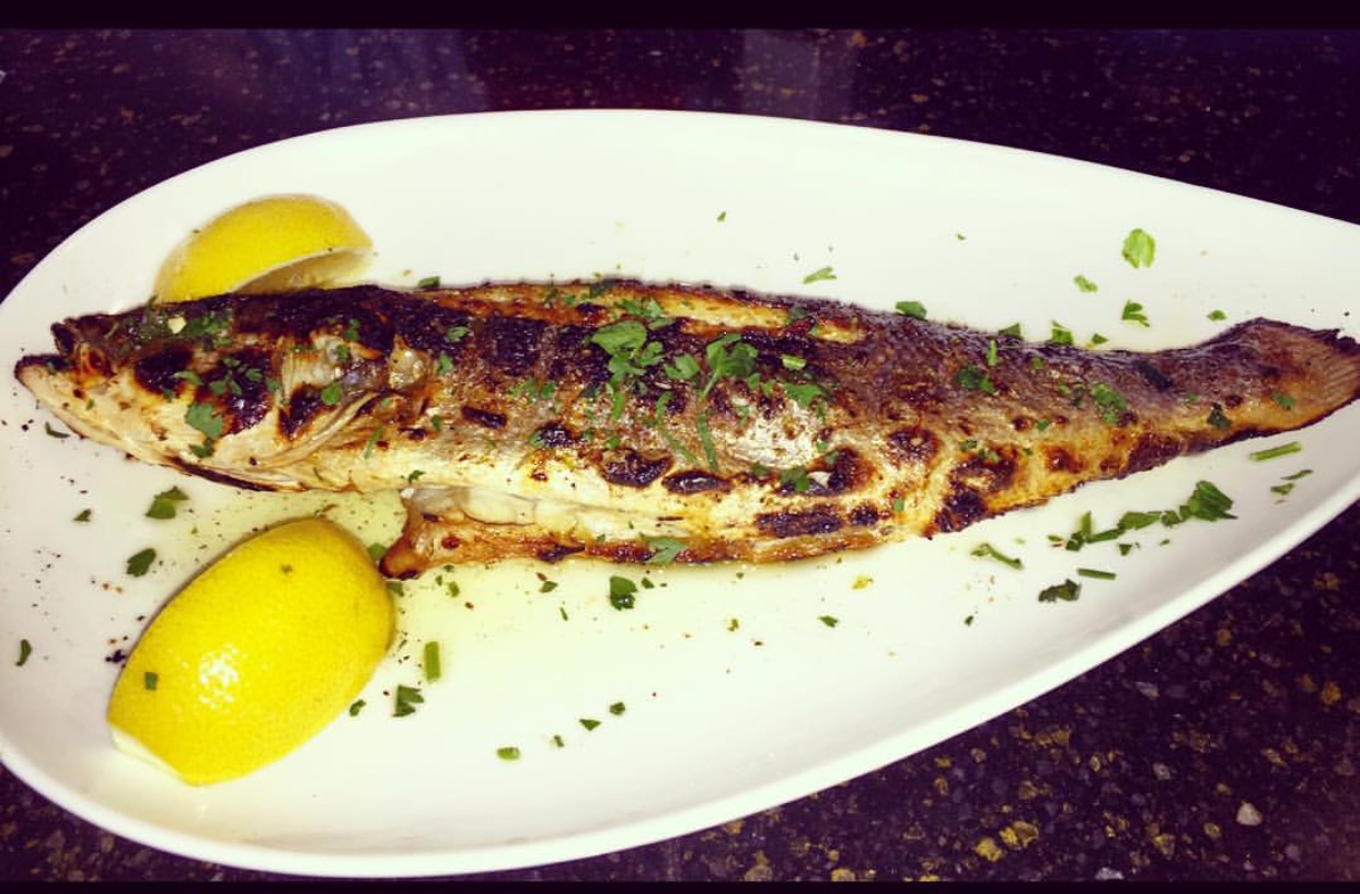 Order BRONZINO (600-800grams) with 2 sides food online from Trapezaria Kuzina store, Rockville on bringmethat.com