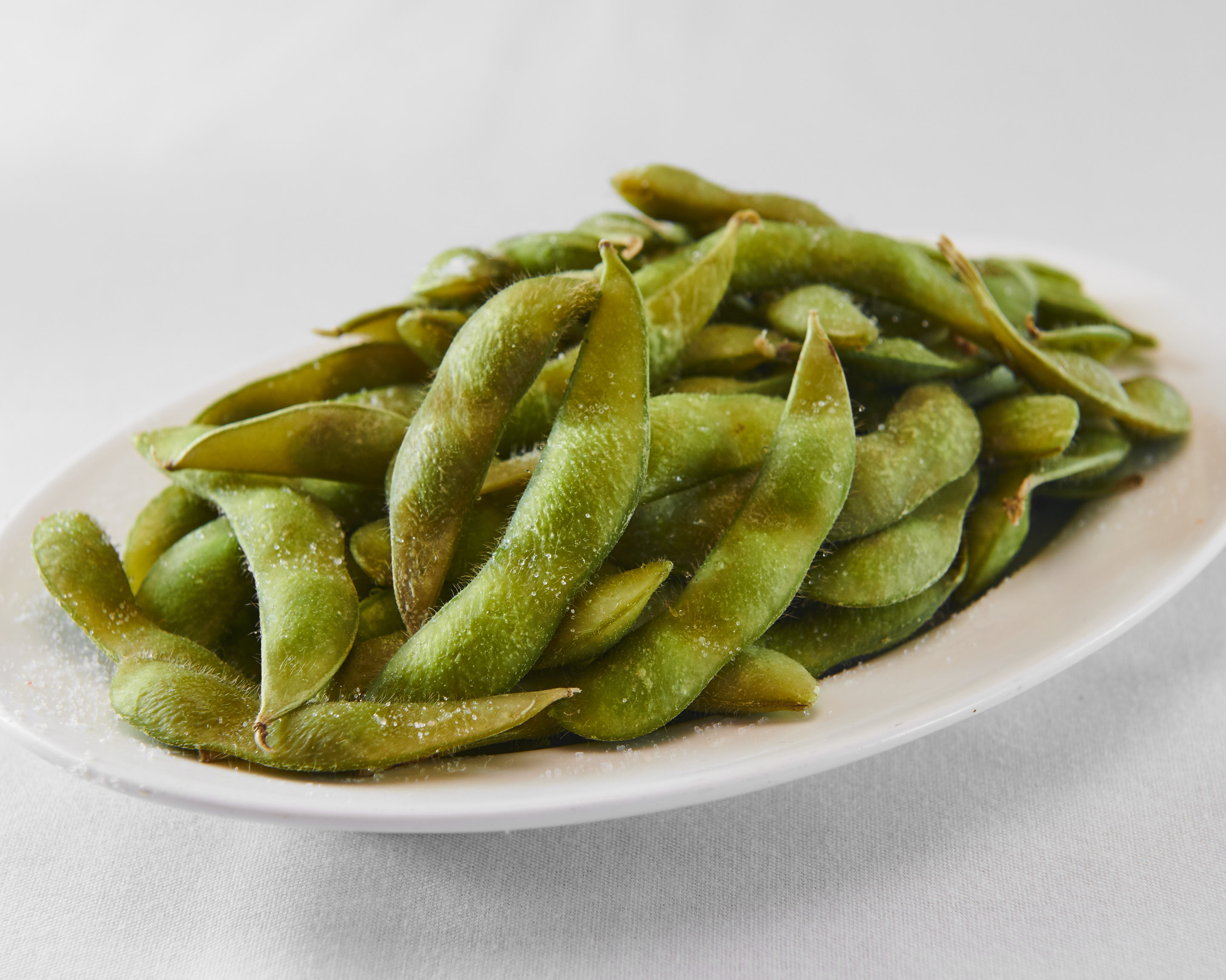 Order A1. Edamame food online from Ollie's Noodle Shop & Grille store, New York on bringmethat.com