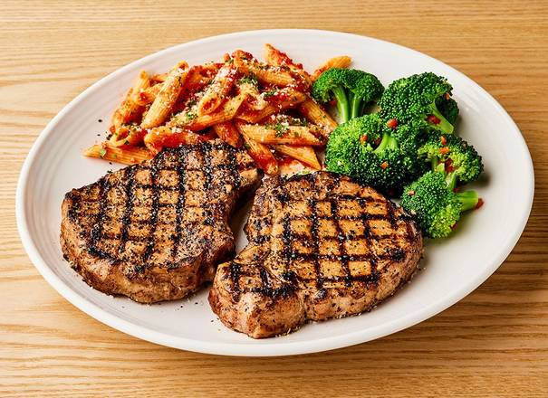 Order Tuscan-Grilled Pork Chop* - Two Chops food online from Carrabba's store, Greensboro on bringmethat.com