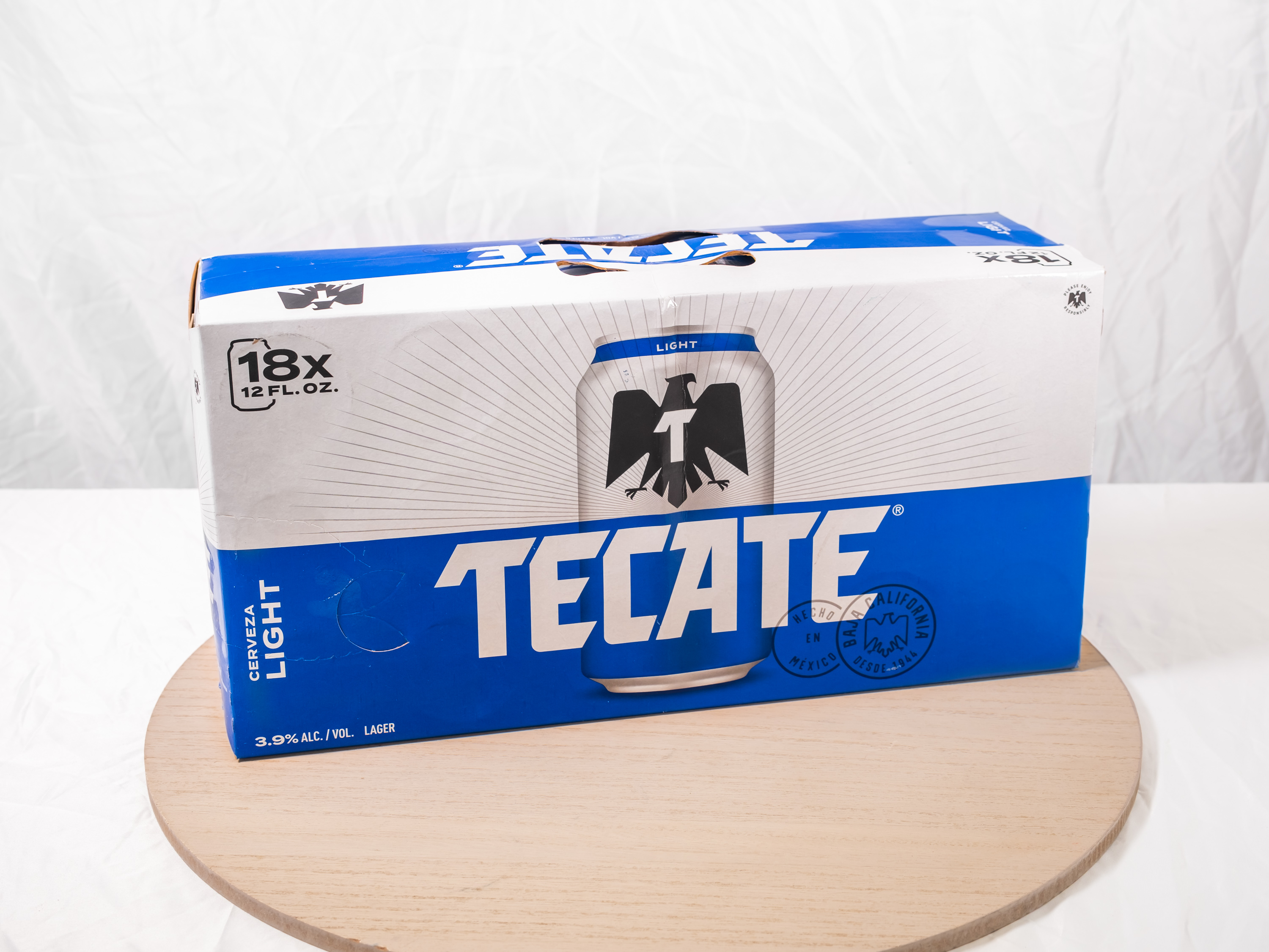 Order 18 pack of Canned Tecate Light food online from M & G Market store, Highland on bringmethat.com