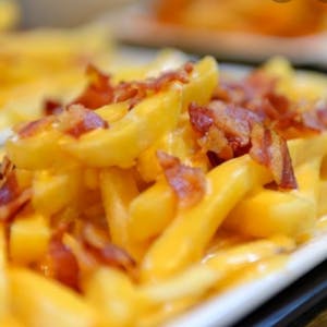 Order Bacon Cheese Fries food online from Desia Spicy Bites store, Branson on bringmethat.com