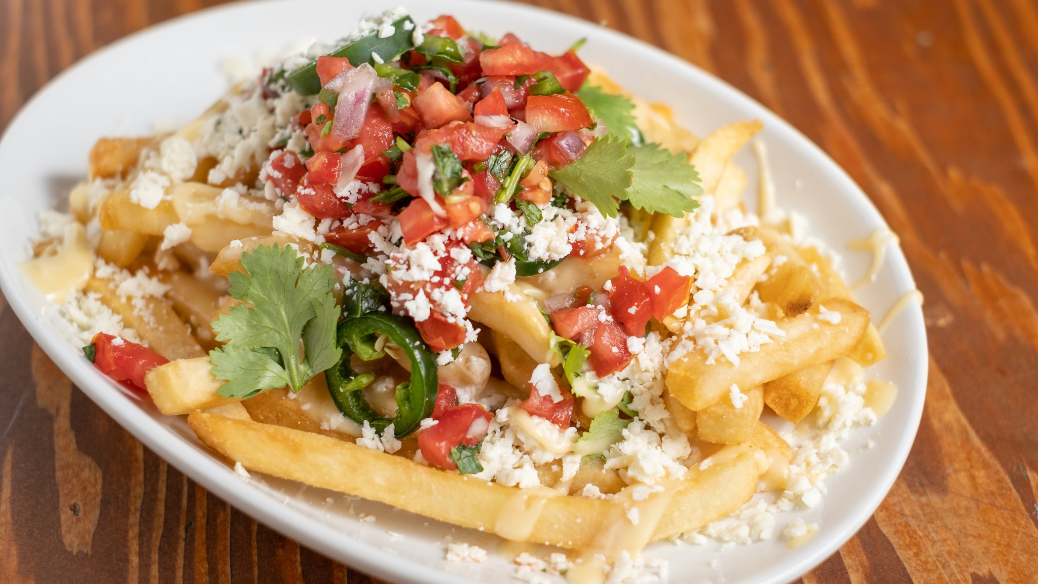 Order Mexican Cheese Fries food online from Johnny Pistolas store, Washington on bringmethat.com