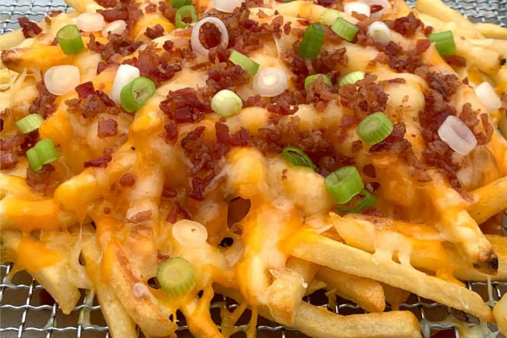 Order French Fries with Bacon, Cheese and Scallions food online from O'callaghan Pub store, Rochester on bringmethat.com