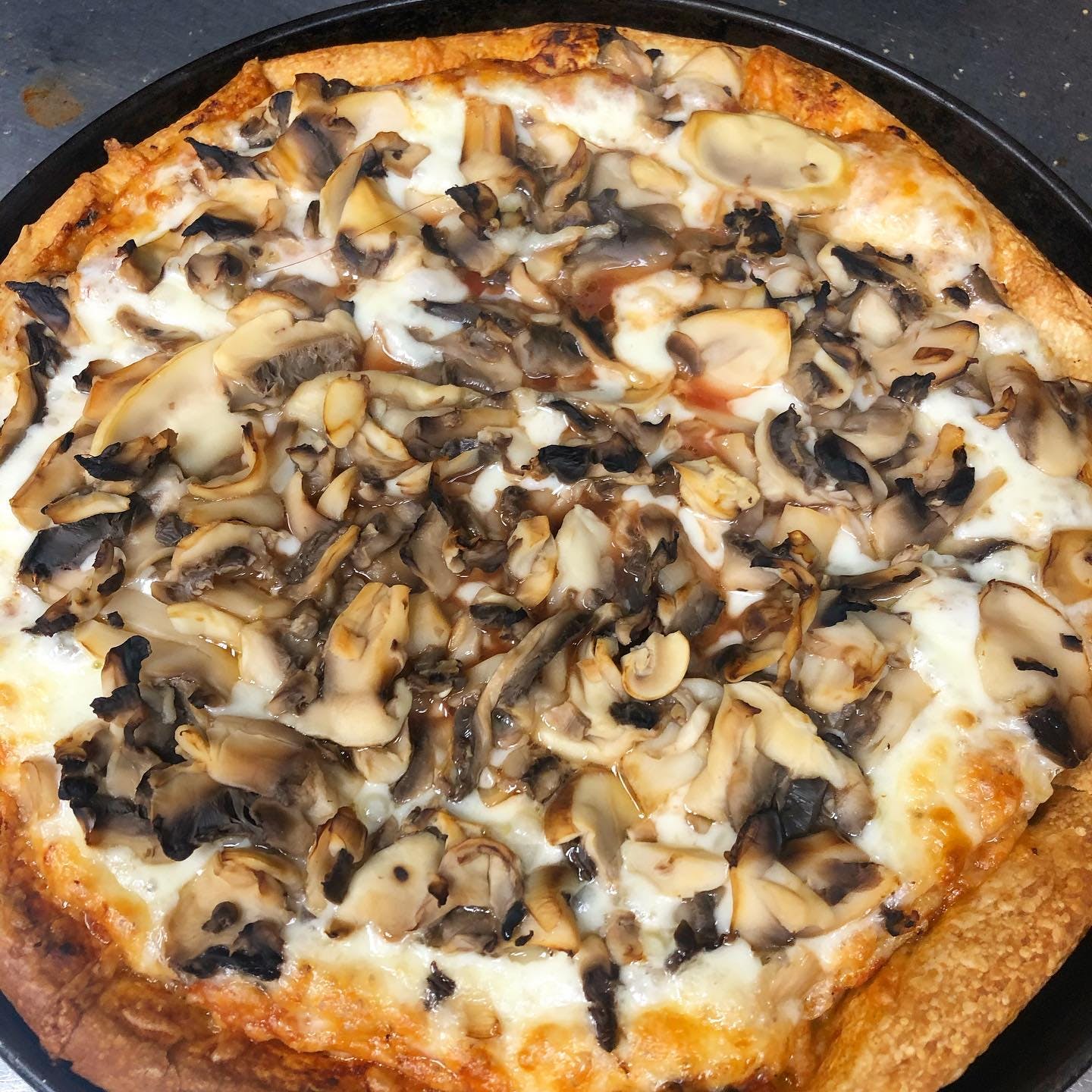 Order Mushrooms Pizza - Small 10" food online from Johnny's Pizza store, Brooklyn on bringmethat.com