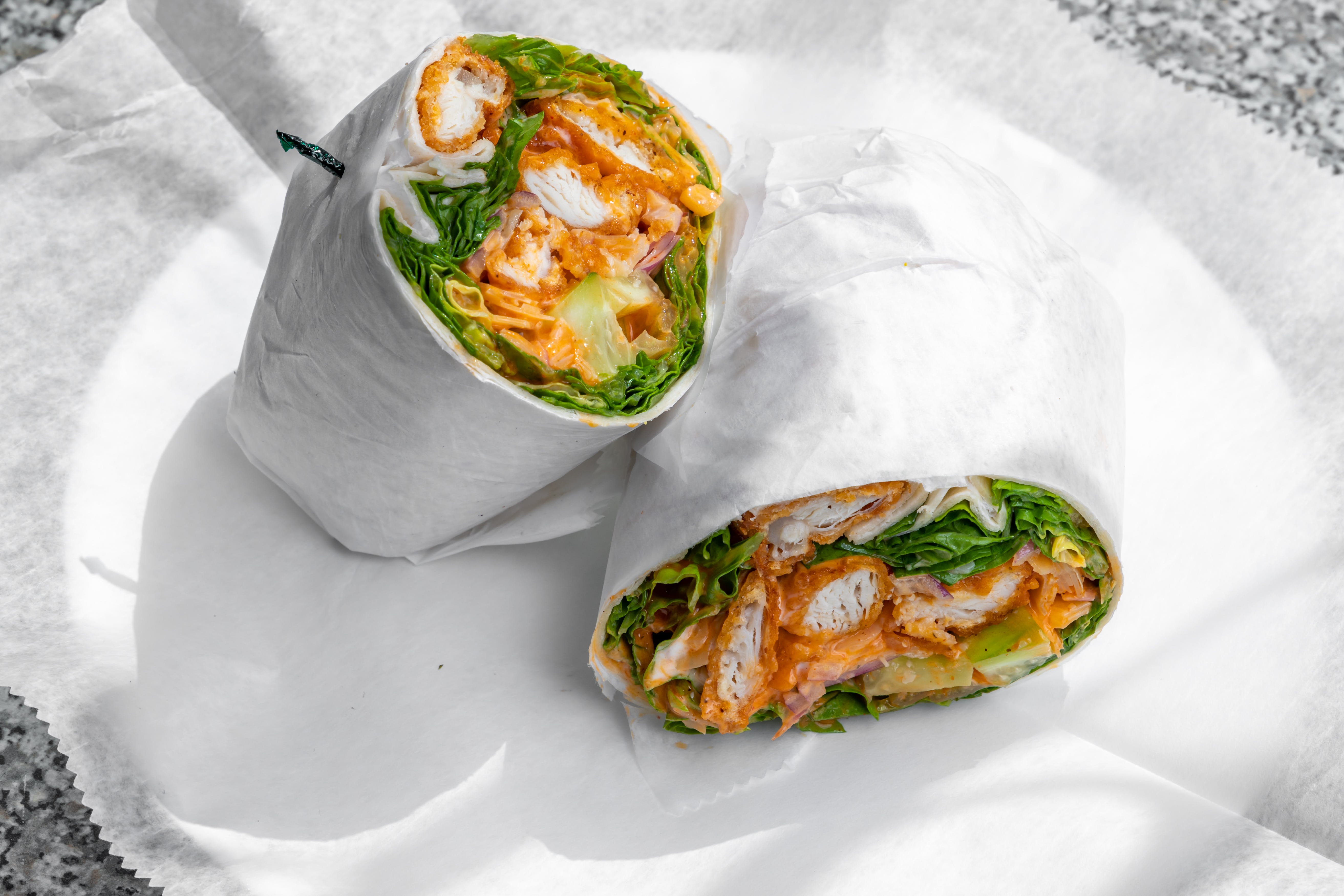 Order Buffalo Caesar Wrap - Wrap food online from Ellie's Pizza store, Beverly Farms on bringmethat.com