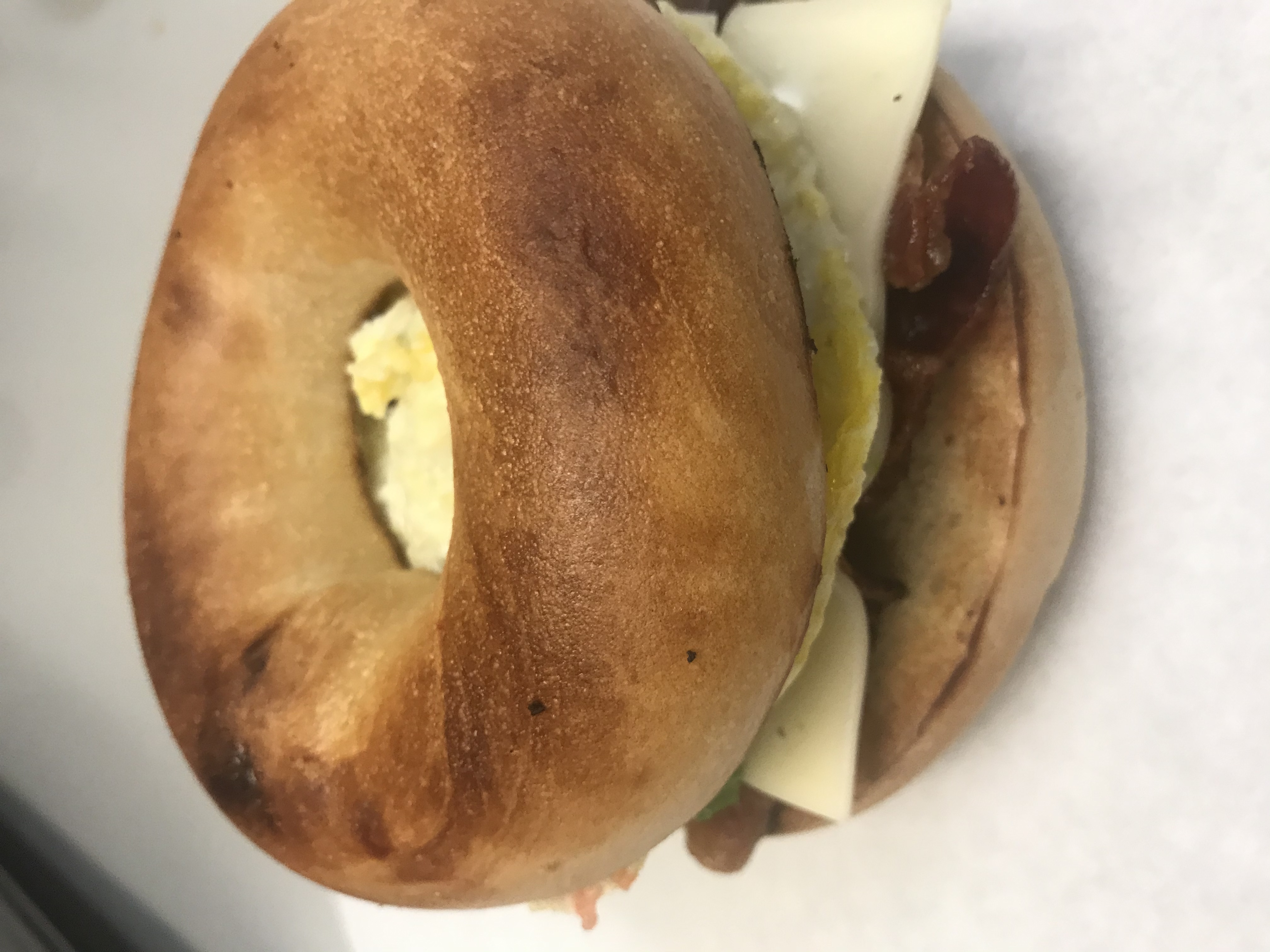 Order 15 Omelet Bagel with Bacon and Cheese food online from Michael Donuts store, Hungtington Beach on bringmethat.com