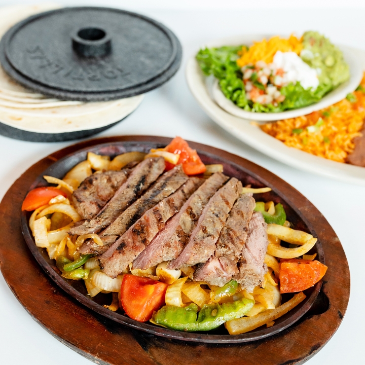 Order Sizzling Steak Fajitas food online from El Fenix store, Dallas on bringmethat.com