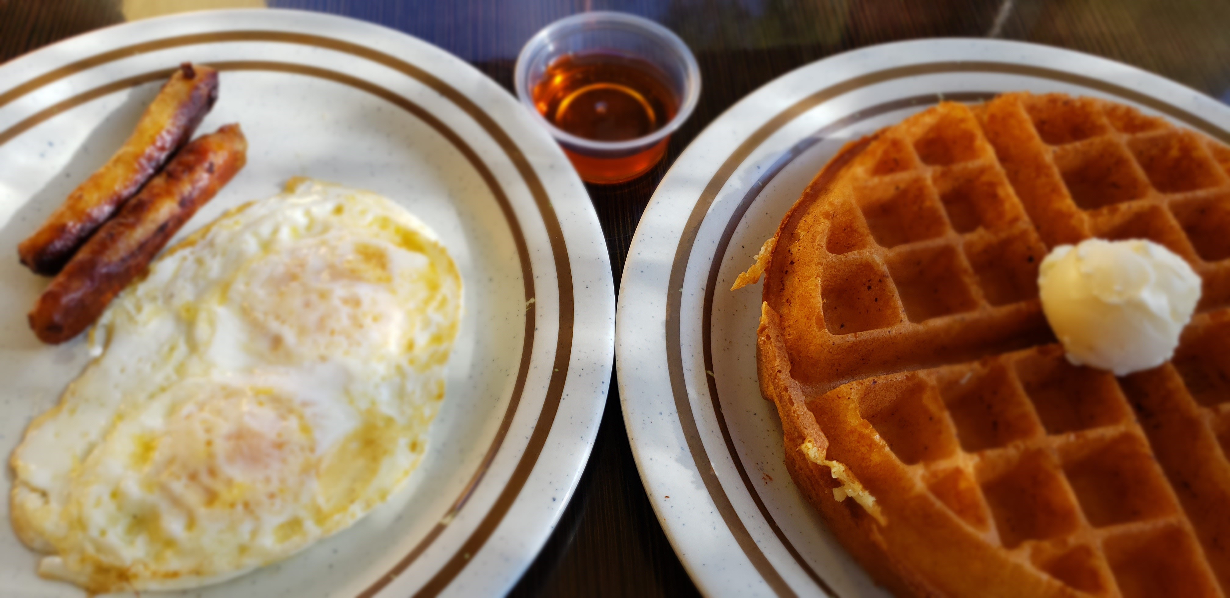 Order 2 Eggs, 1 Waffle and 2 Sausage food online from Breakfast Cafe store, Oak Park on bringmethat.com