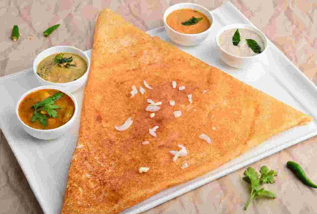 Order Onion Dosa food online from Peacock Indian Cuisine store, Plano on bringmethat.com