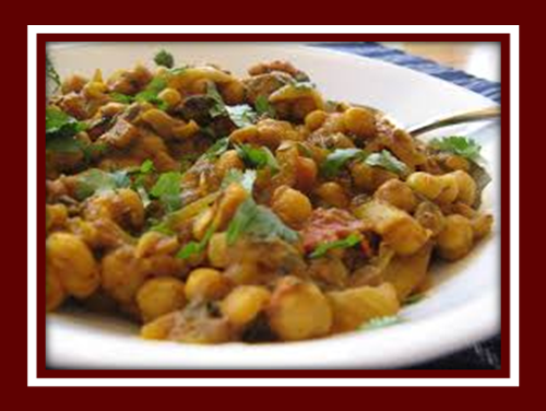 Order Chana Masala food online from Cosmo Indian Cafe store, Lawrence on bringmethat.com