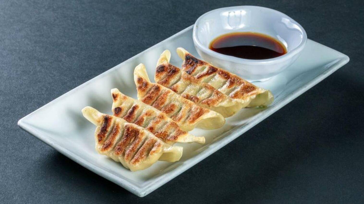 Order (g207) Pan Fried Gyoza food online from Sushi Stop store, Los Angeles on bringmethat.com