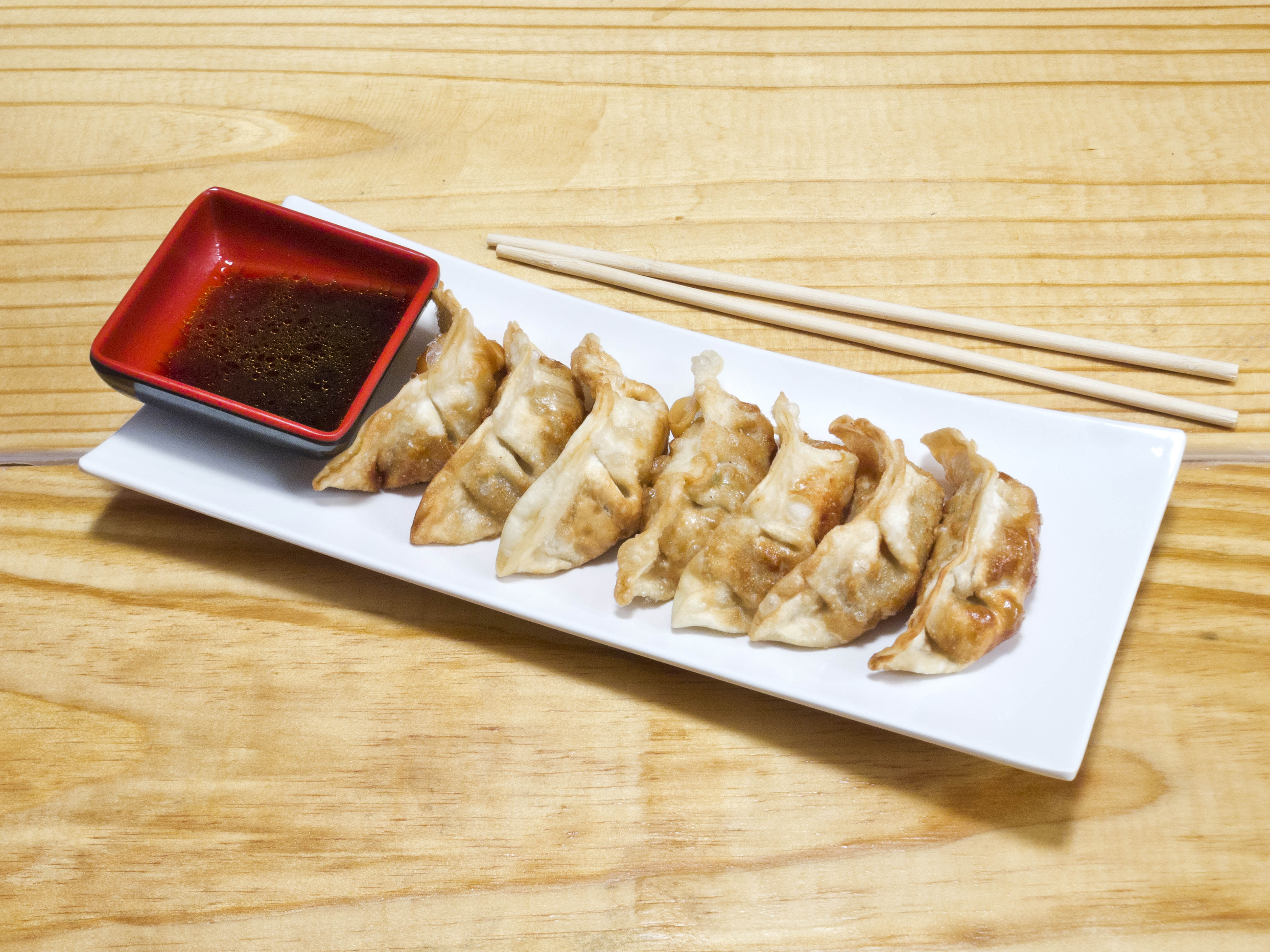 Order Dumpling ( 6pcs ) food online from Zizi Ramen & Sushi store, Dallas on bringmethat.com