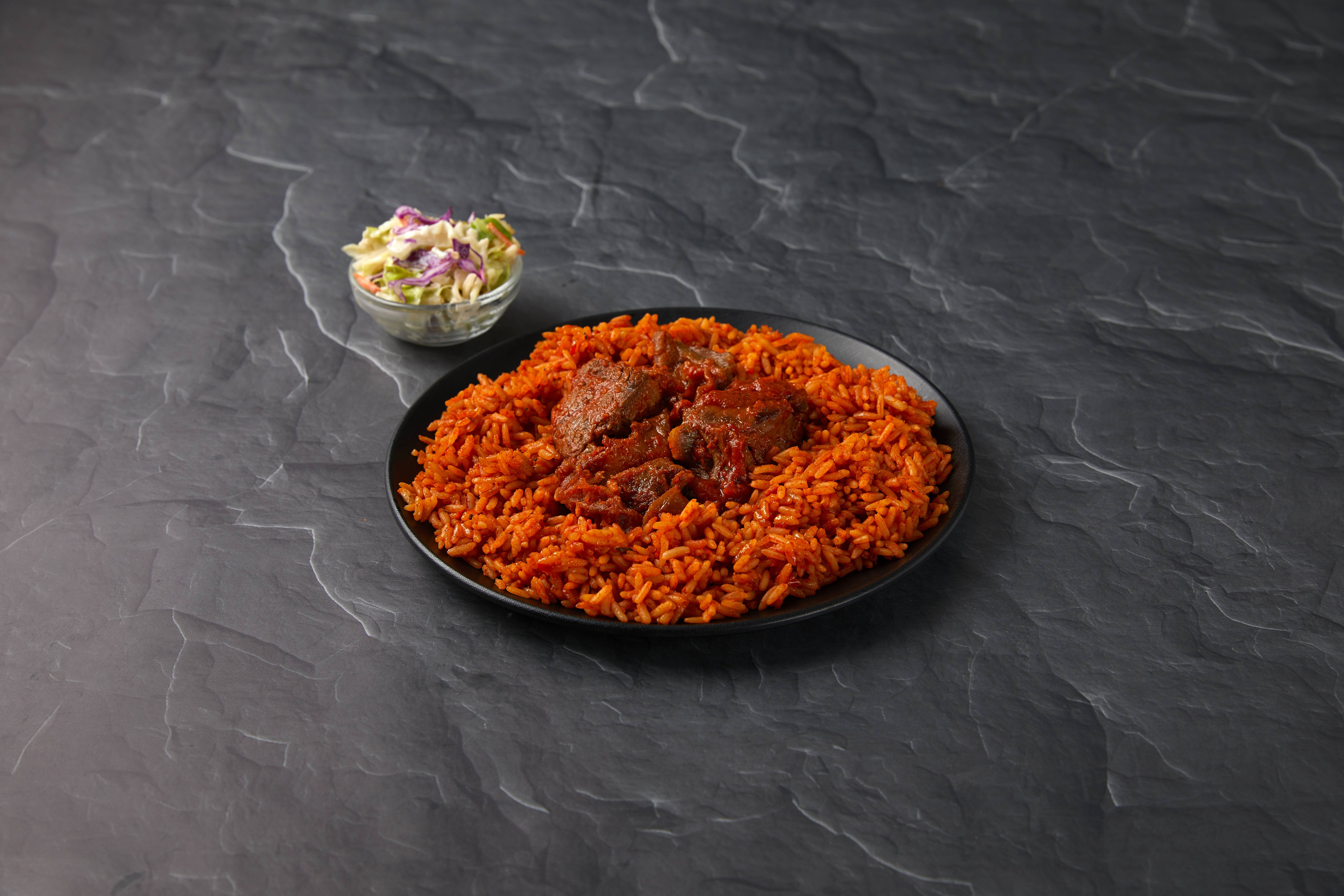 Order Jollof Rice Entree food online from Soul of Afrika store, Las Vegas on bringmethat.com