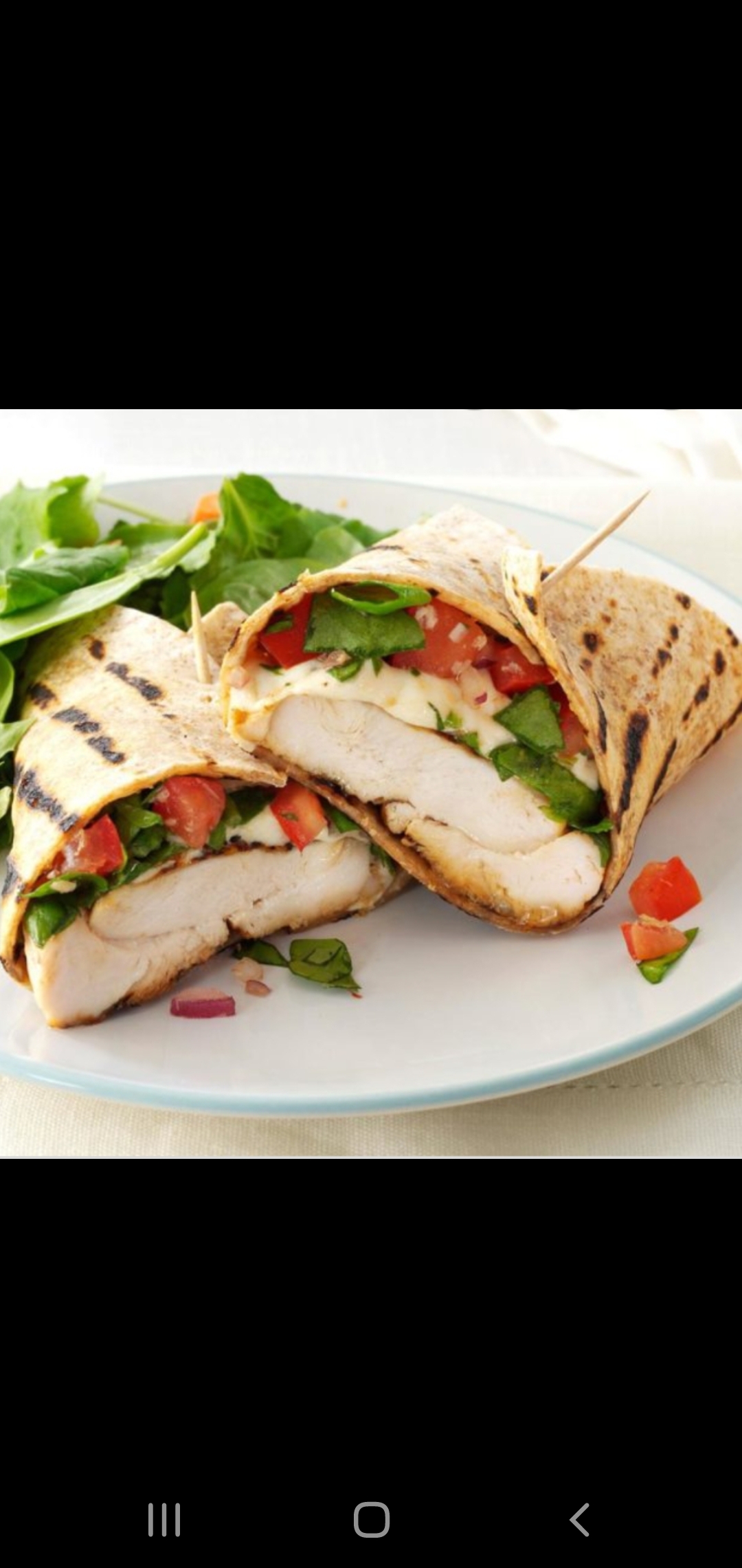 Order  Wonder Woman Wrap (grilled chicken & cheese sautéed onions lettuce tomatoes) food online from American Gourmet Foods Deli store, New York on bringmethat.com
