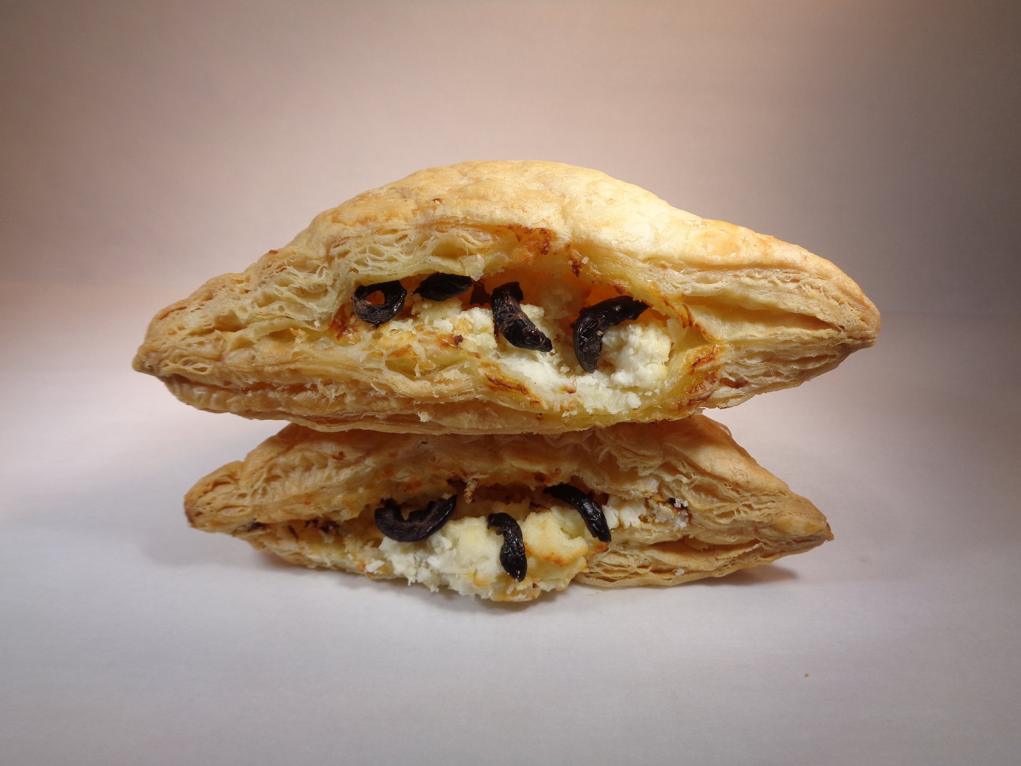 Order Feta Cheese & Black Olives Puff Pastry - 2 Pieces food online from Lema Bakery store, Houston on bringmethat.com