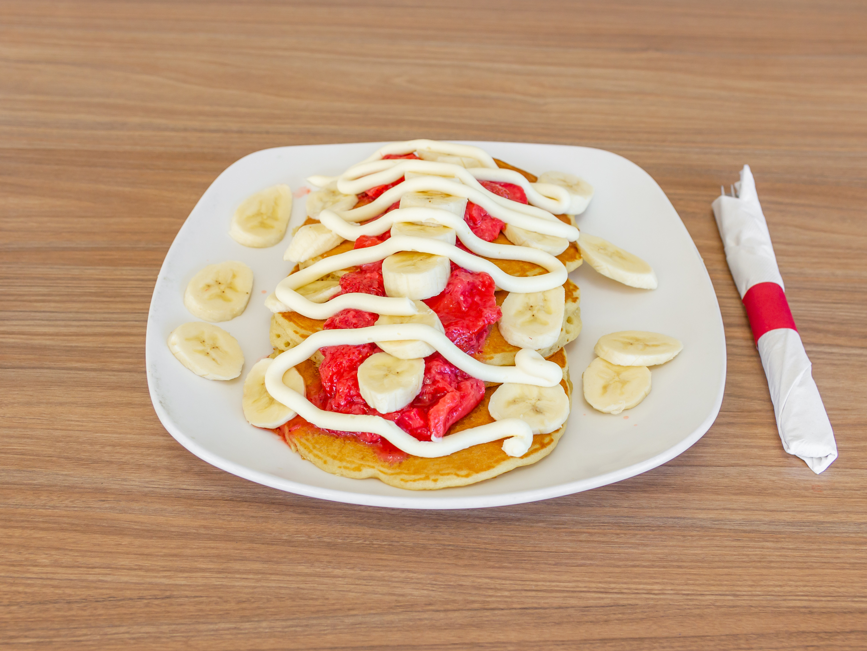 Order Strawberry Banana Pancakes food online from Village Gourmet Hot Dogs store, Westland on bringmethat.com