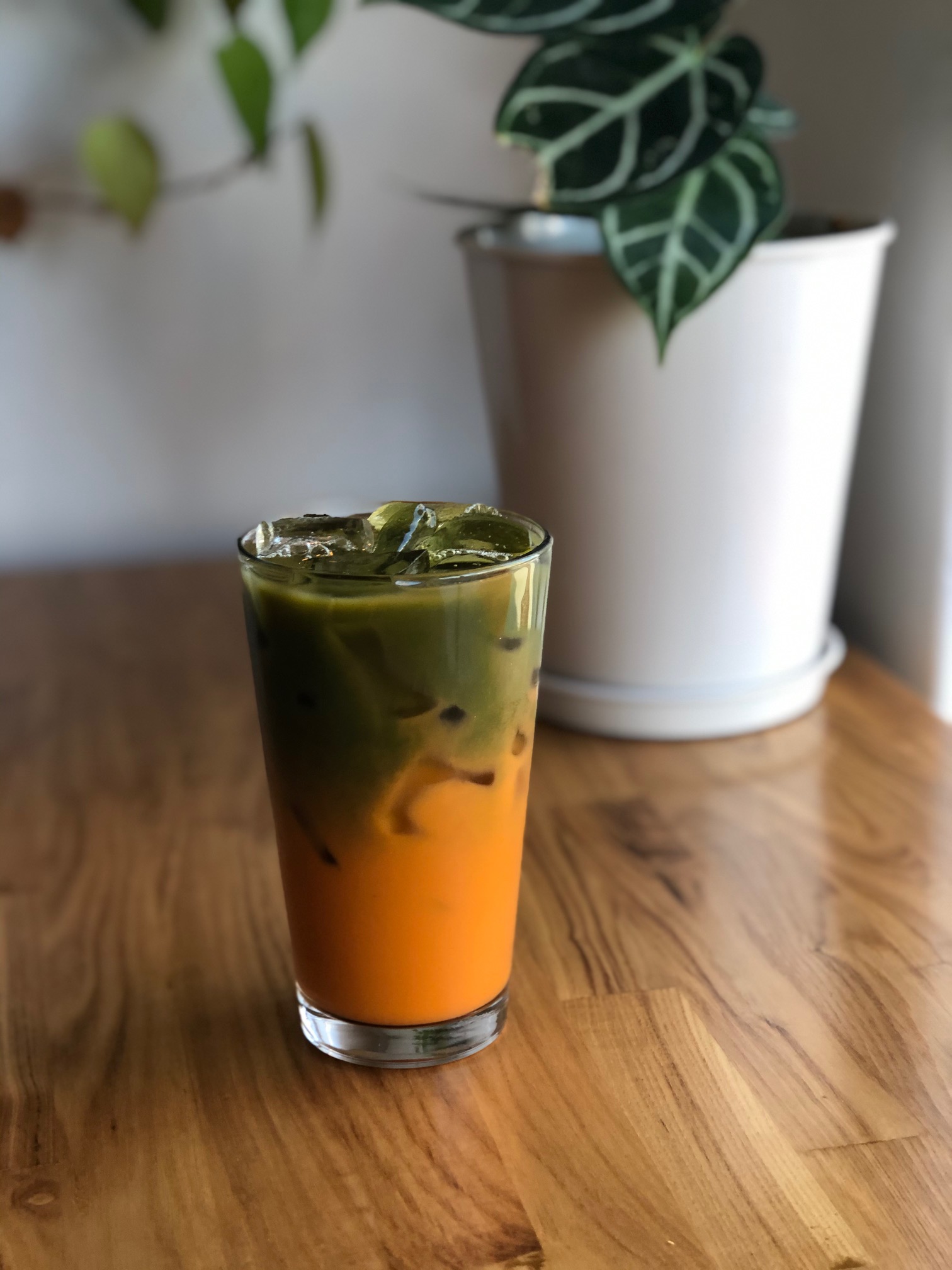 Order Iced Matcha + Thai Tea food online from Good Goose Cafe store, Los Angeles on bringmethat.com