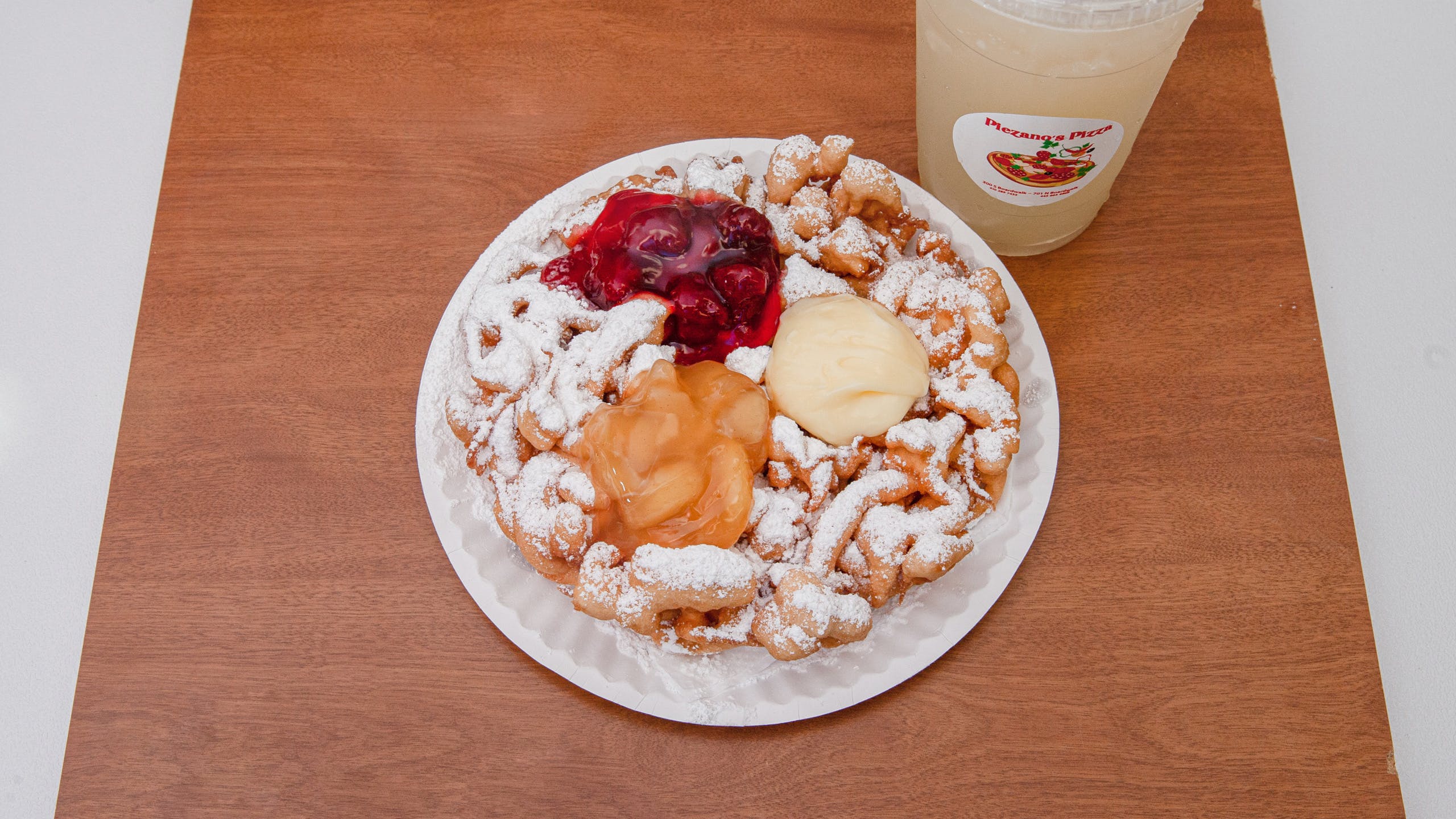 Order Funnel Cake with All Toppings - Dessert food online from Piezano Pizza store, Ocean City on bringmethat.com