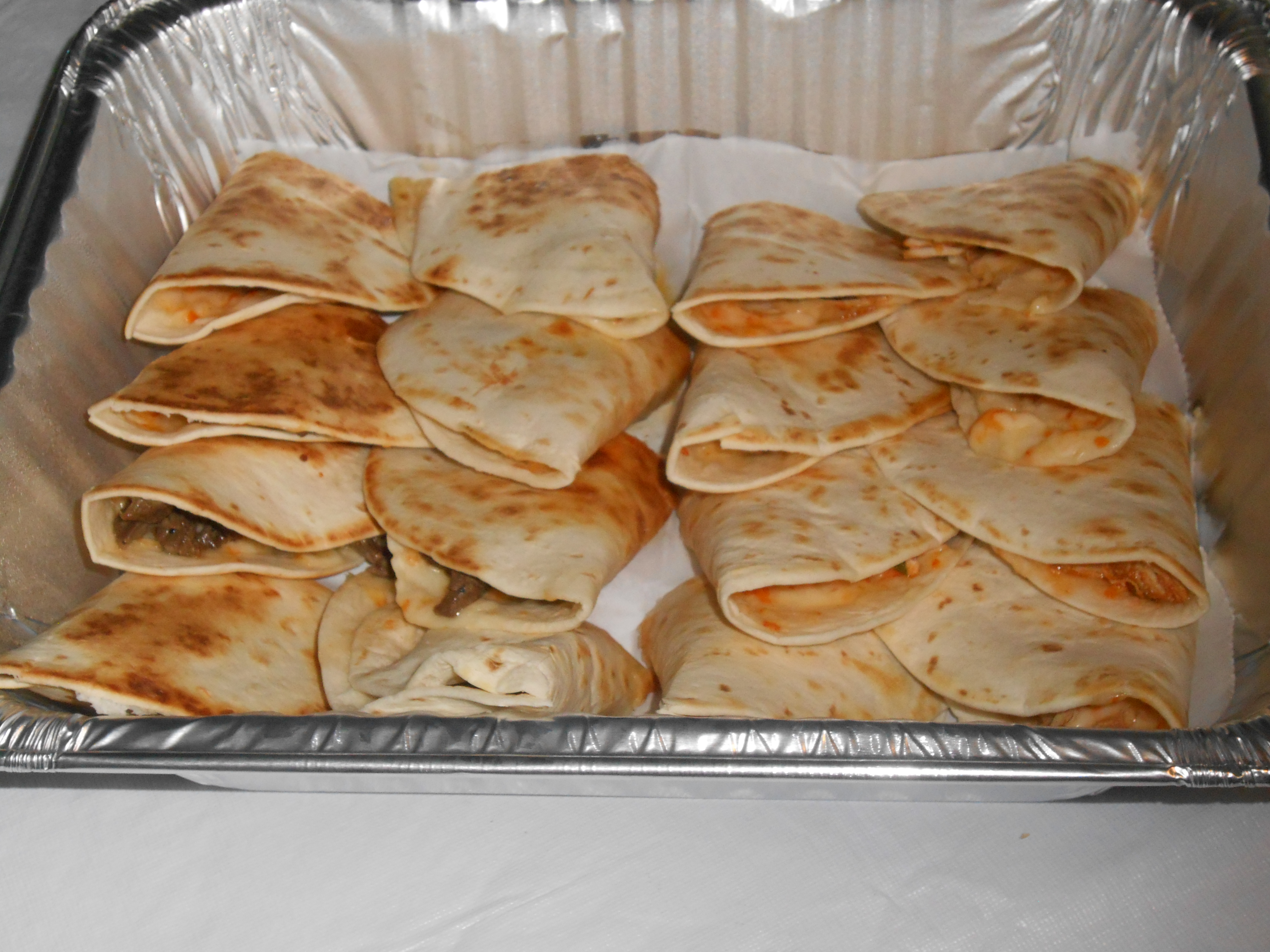 Order Quesadillas 1/2 Tray food online from Papacito's Mexican Grille & Catering Service store, Chicago on bringmethat.com